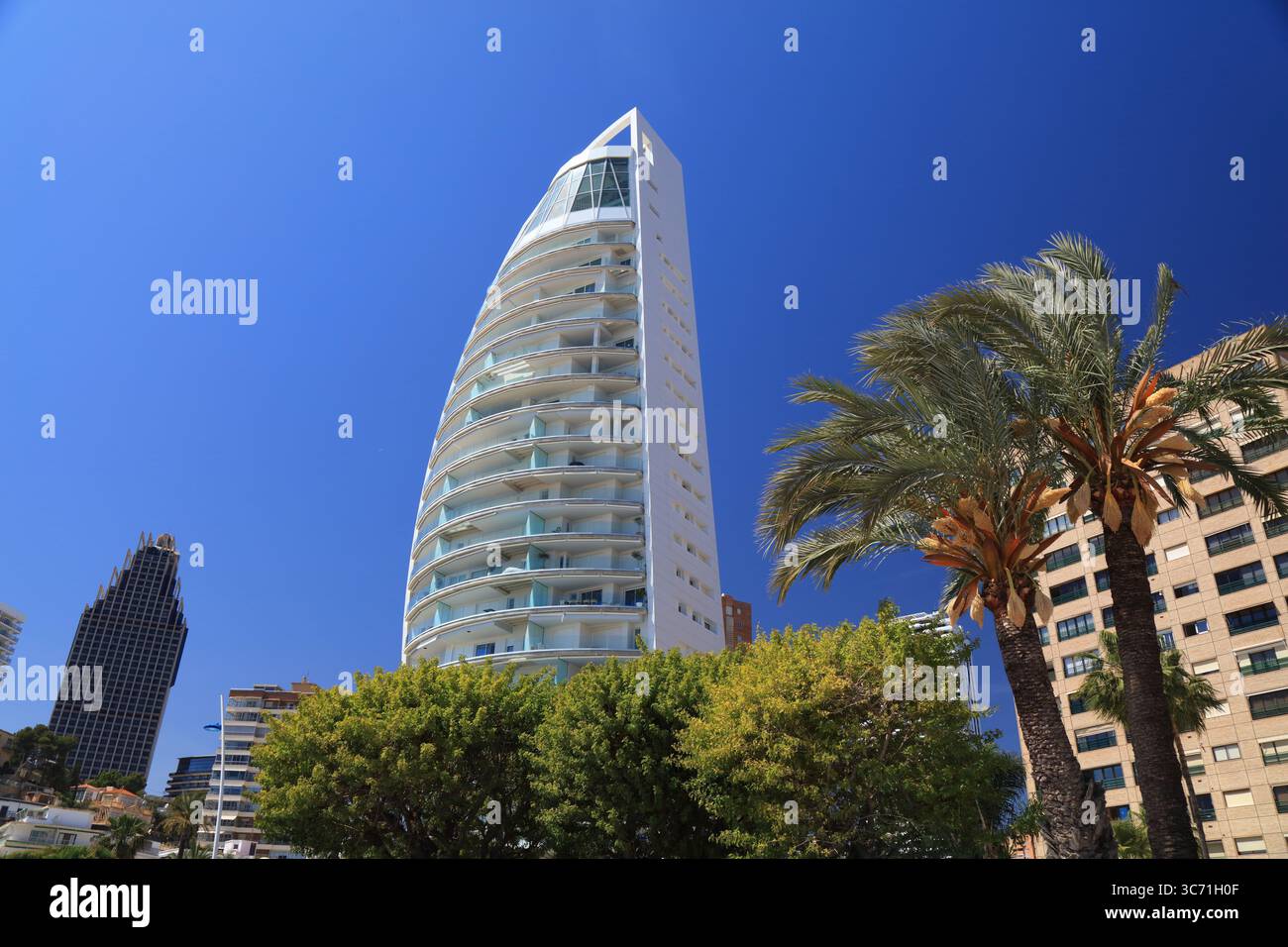 BENIDORM, SPAIN - APRIL 9, 2025: Delfin Tower apartment building in Poniente neighborhood of Benidorm, Spain. Stock Photo