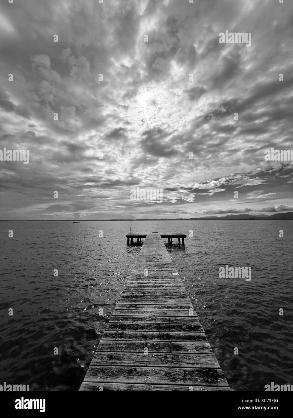 Jetty with dramatic sky at Lazise on Lake Garda, Italy - Smartphone Captured Stock Image