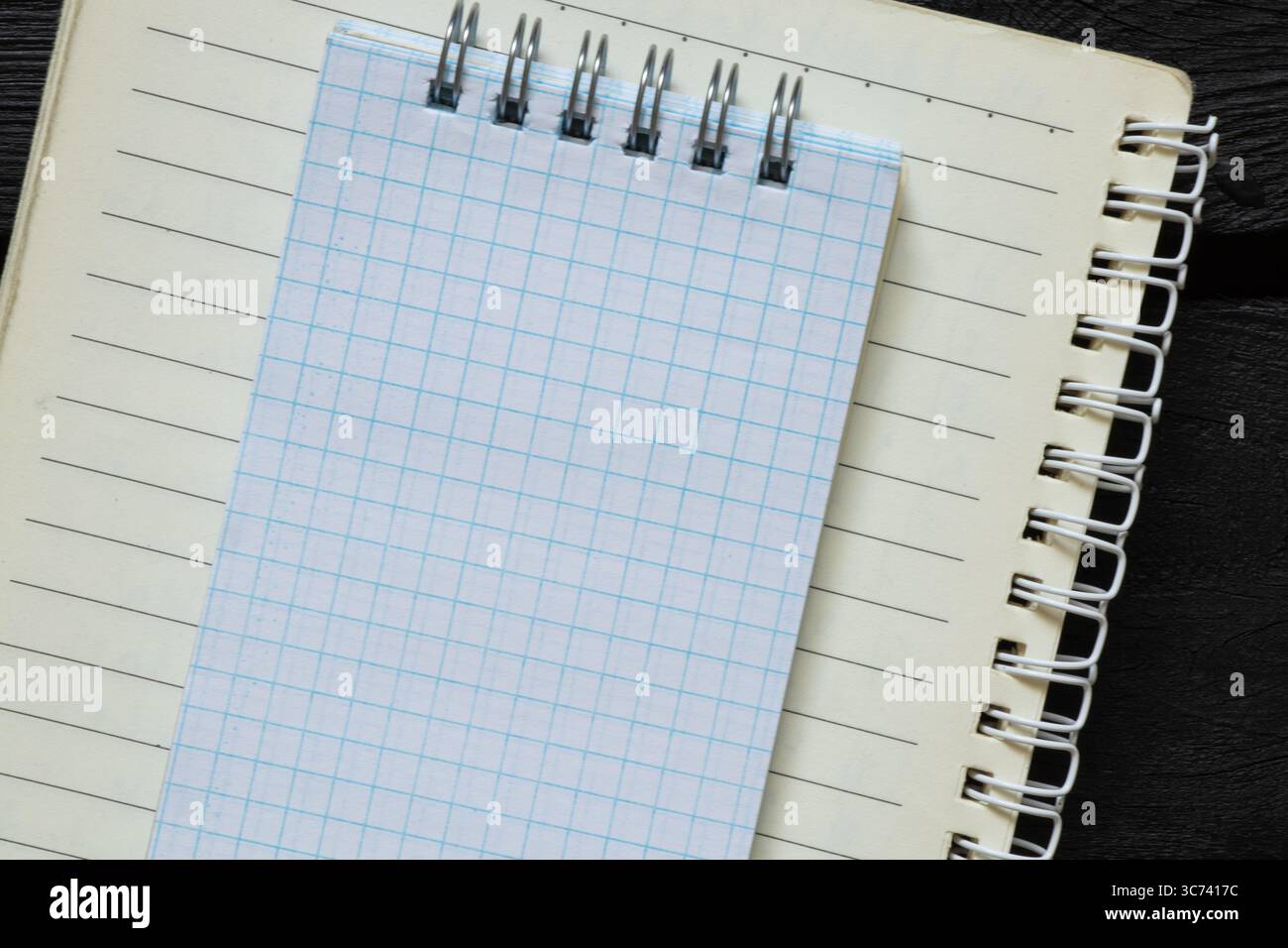 Open Notebook Chekered Open notebook in line with white checkered notebook on top, both on ...
