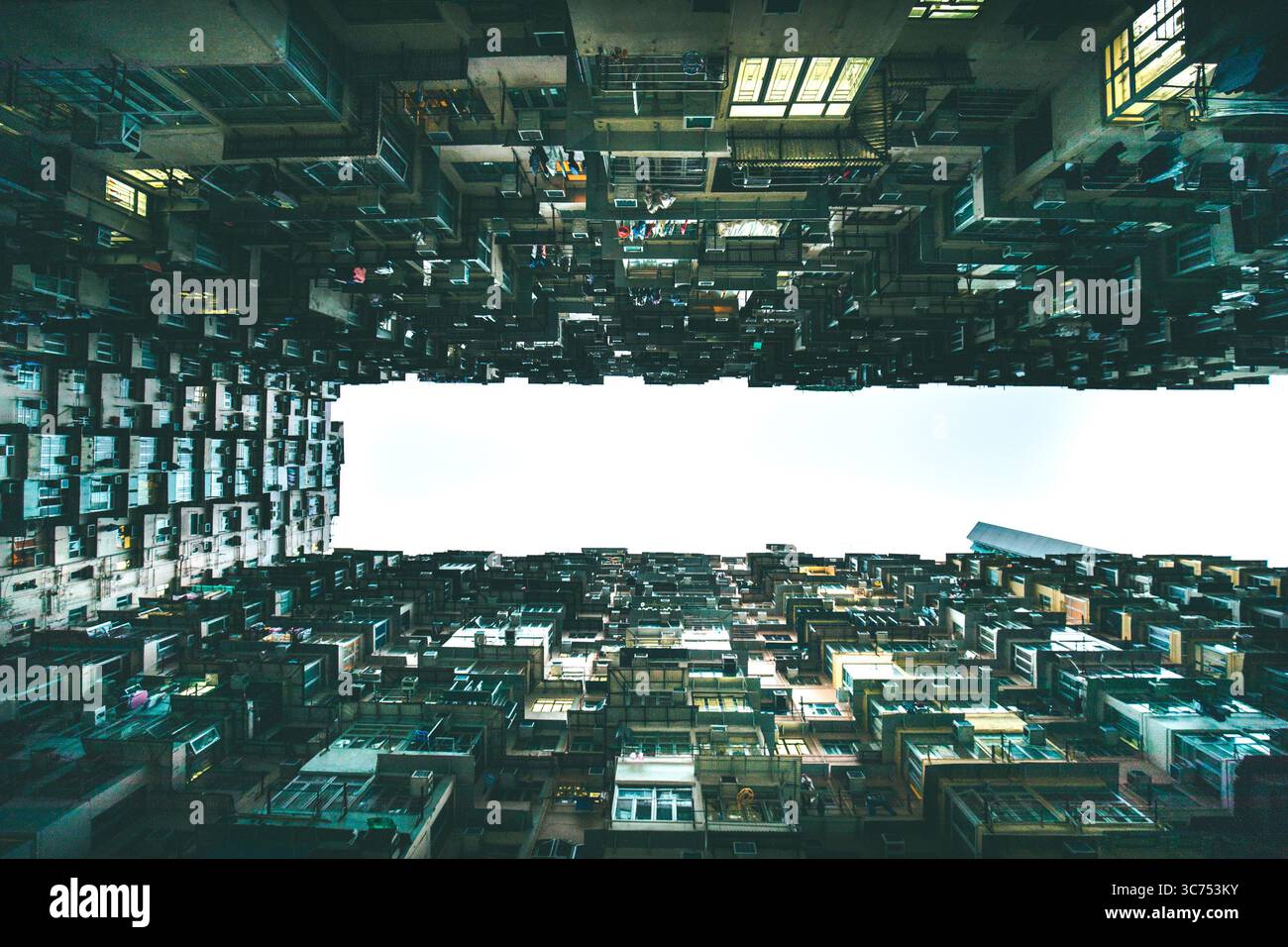 Dense cluster of high-rise residential buildings at 山海樓, a famous urban photography spot in Hong Kong known for its striking architectural patterns. Stock Photo