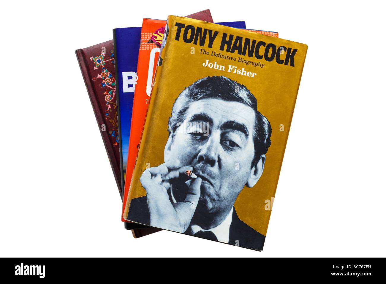Selection of hardback books with Tony Hancock the Definitive Biography  book by John Fisher on top isolated on white background Stock Photo