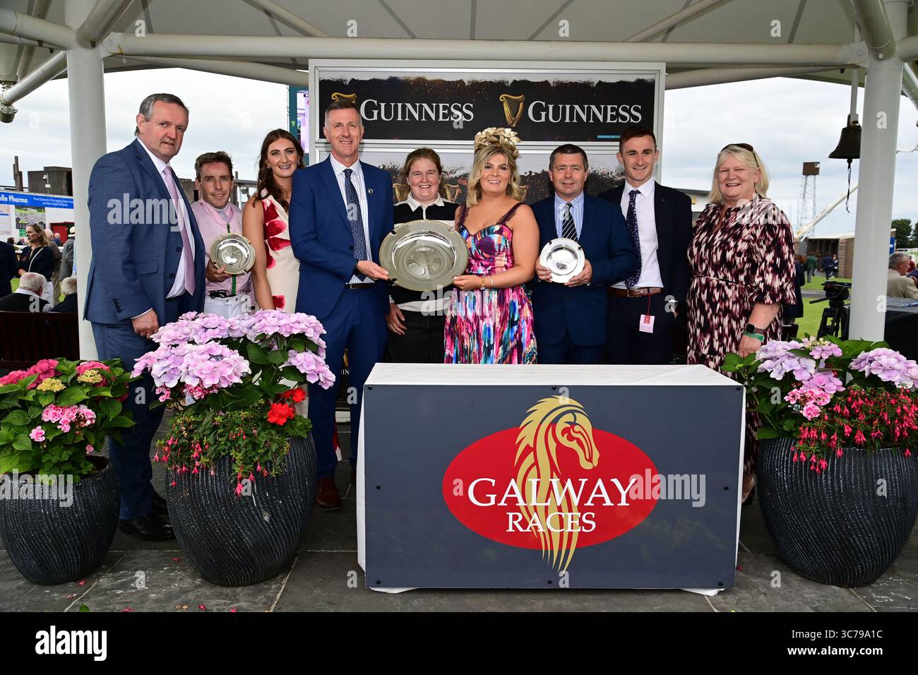 Jockey Leigh Roche (second left), trainer Jarleth Fahey (third right ...