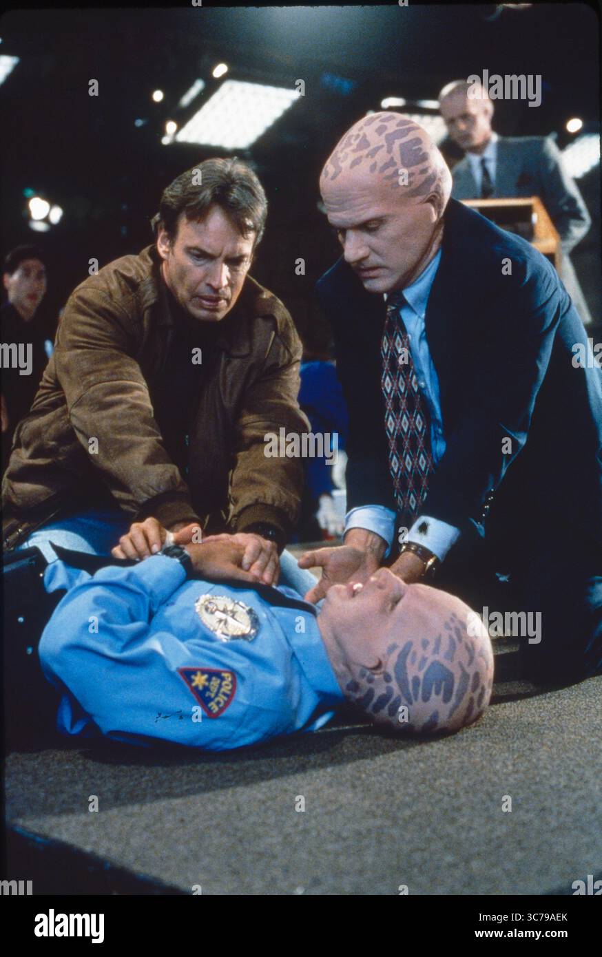 RELEASE DATE: 1998 TITLE: Alien Nation STUDIO: Fox Broadcasting PLOT: The franchise is set in the near future in the United States. In 1991 a flying saucer crashes in the Mojave Desert containing a race of extraterrestrials, the Tenctonese (called Newcomers by humanity) escaping from slavery under a cruel Overseer race. They resemble humans but have various anatomical differences and have been bred to have greater physical strength and intelligence. The Newcomers are accepted as the latest immigrants to America, and the franchise explores issues around their integration into the multicultural Stock Photo