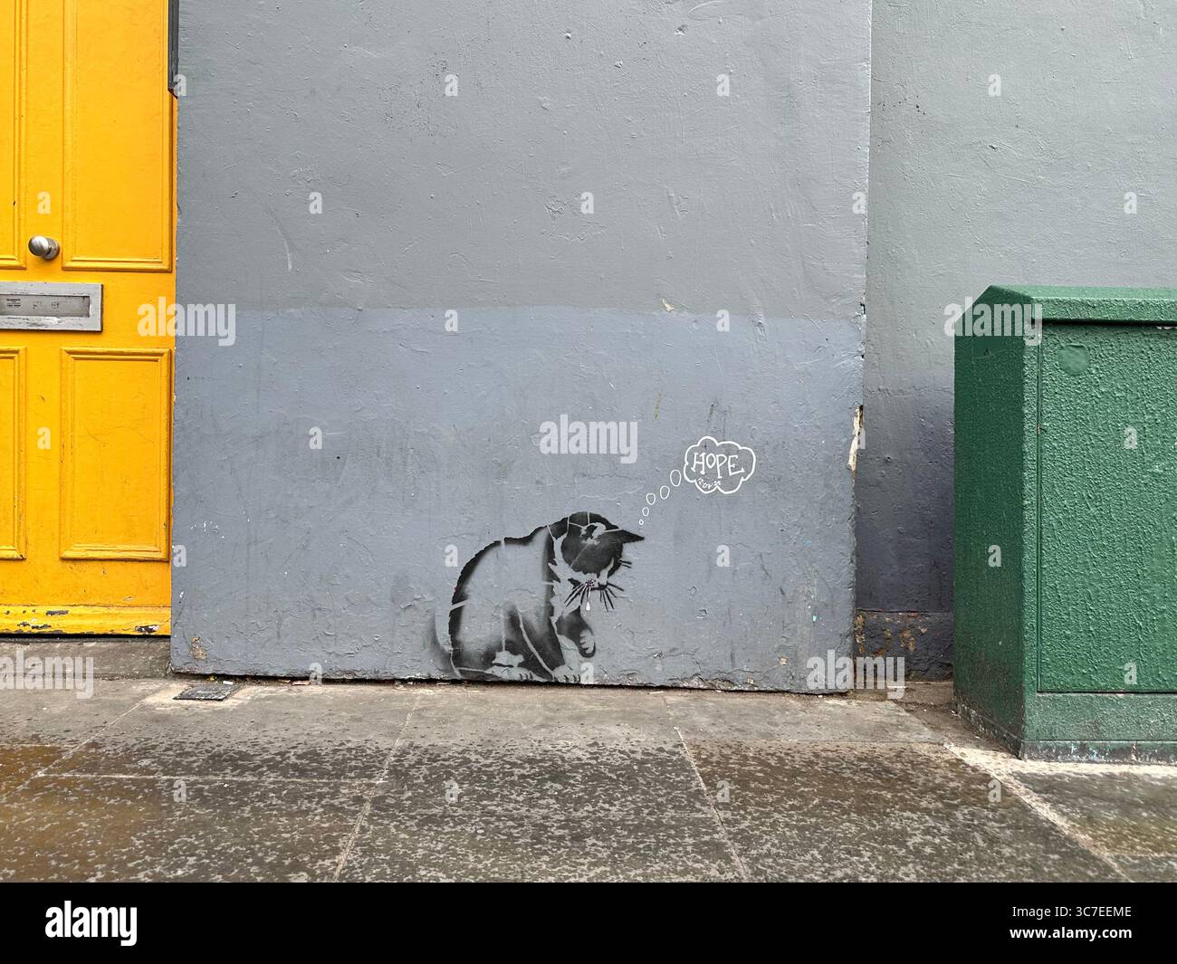 A graffiti of a cat thinking hope in Notting Hill, London, England - Smartphone Captured Stock Image