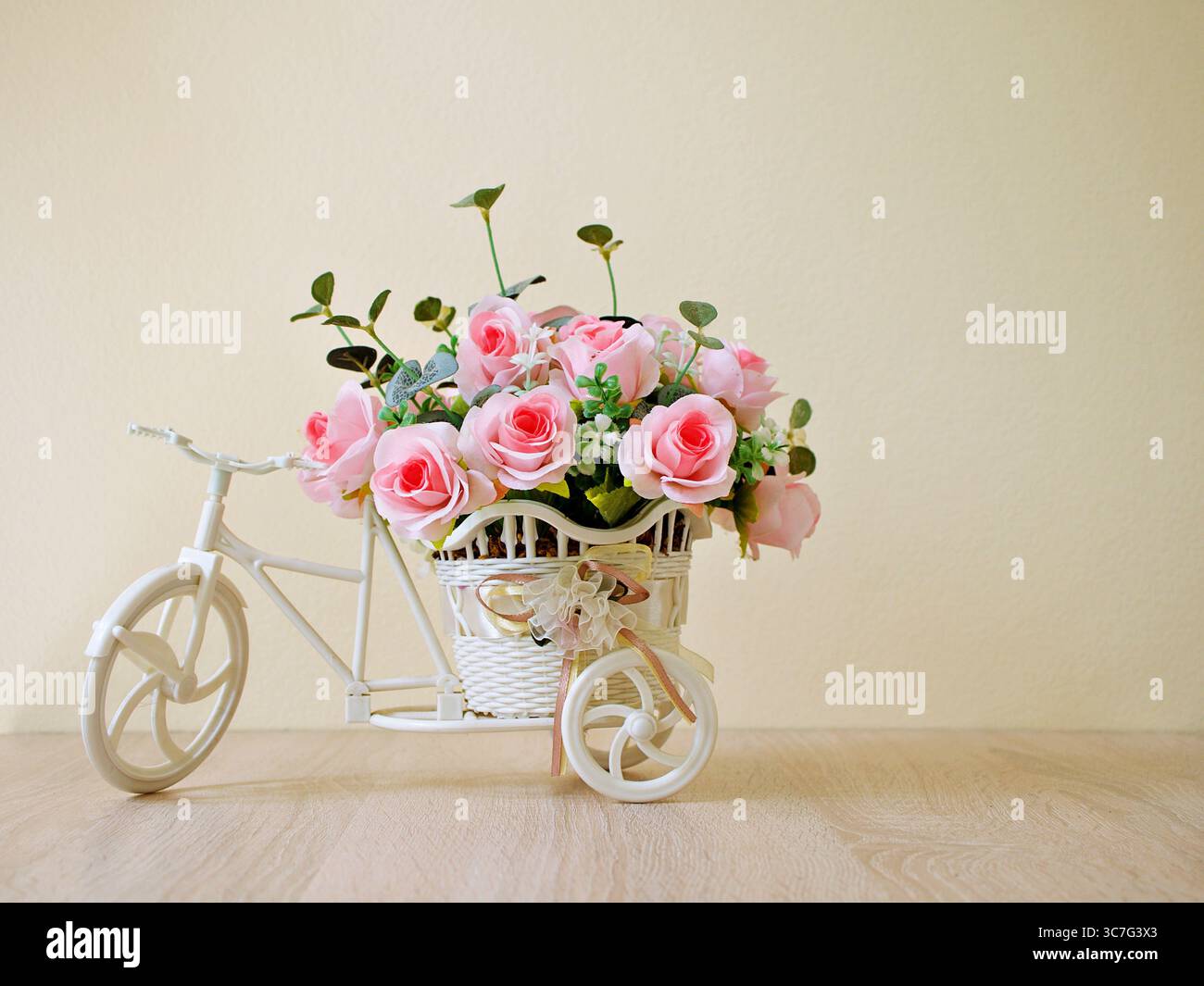 how to fix my rose toy Artificial red rose flowers in bike toy on table bouquet bucket Bicycle  with soft tone for festive background or wallpaper copy space for lettering  Stock Photo