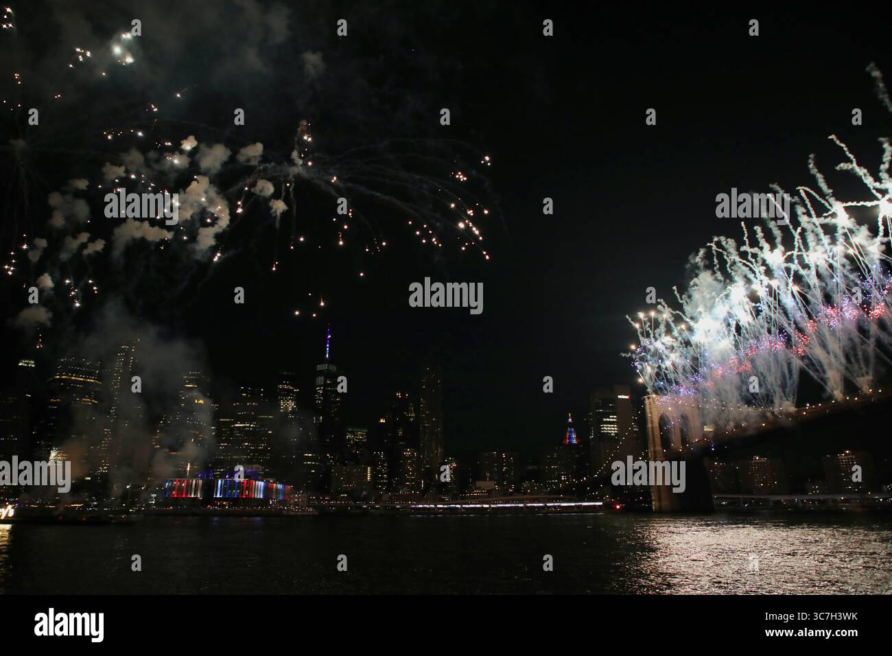 Fourth of July fireworks launched from barges on the East River and ...