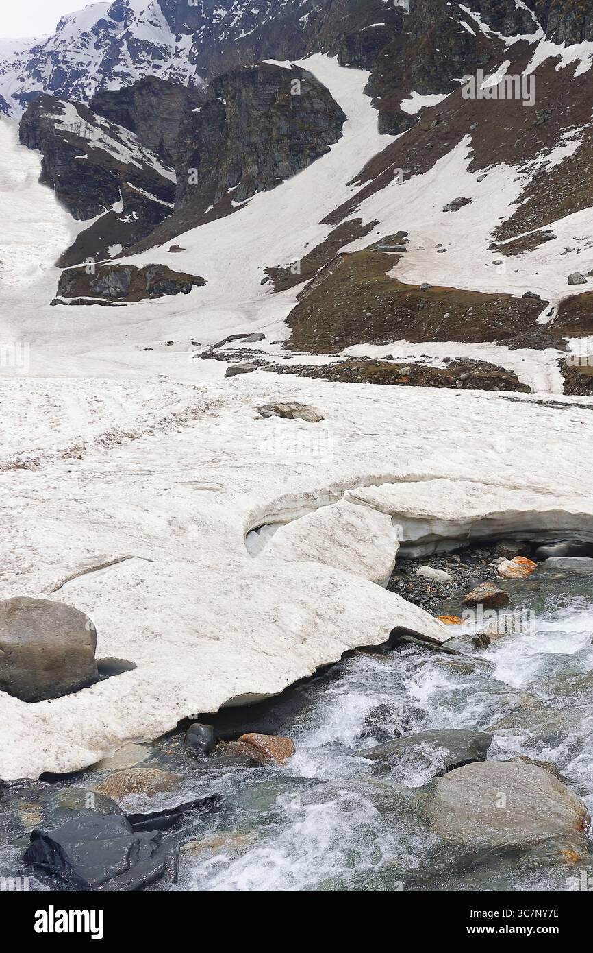 adventure travel in himalaya mountains, high altitude alpine valley covered with glacier at marhi near rohtang pass, manali, himachal pradesh, india Stock Photo