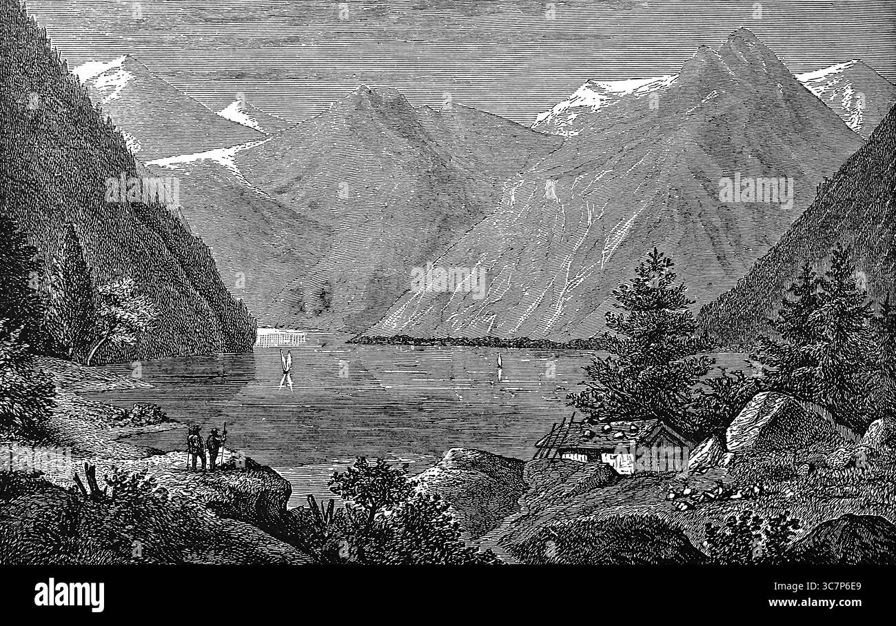 Lake Koenigsee, idyllic mountain landscape, snow-covered mountains, fir trees, sailing boats, hikers, wooden hut, tourist attraction, Bavaria, Germany Stock Photo
