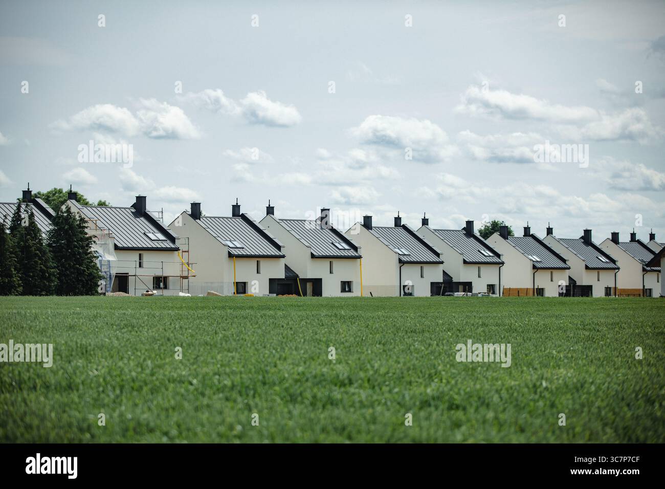 Modern Sustainable Homes Equipped with Solar Panels Set in a Beautiful ...