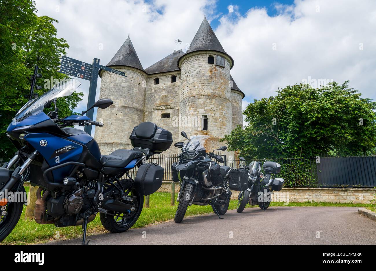 Motorcycles lined up in front of the Tour des Archives in Vernon, Normandy. Stock Photo