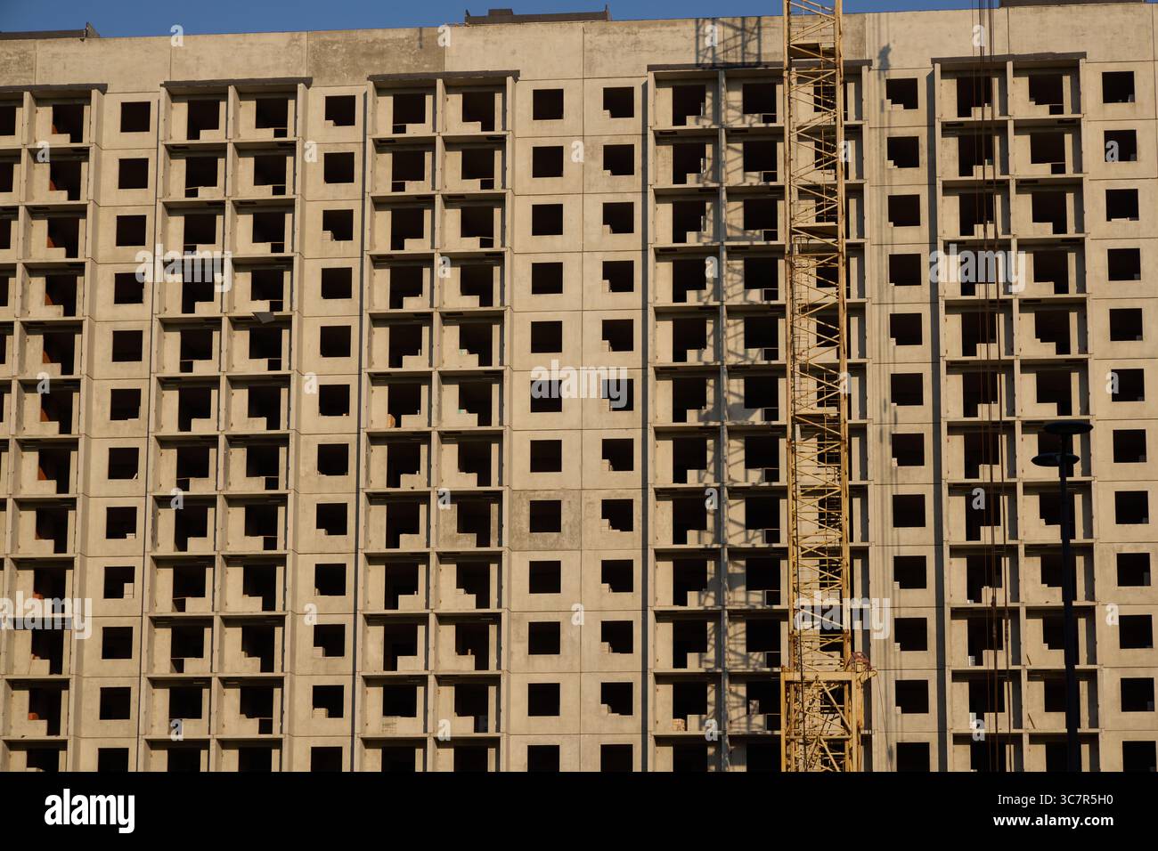 A bustling urban construction site featuring a prominently built concrete structure Stock Photo