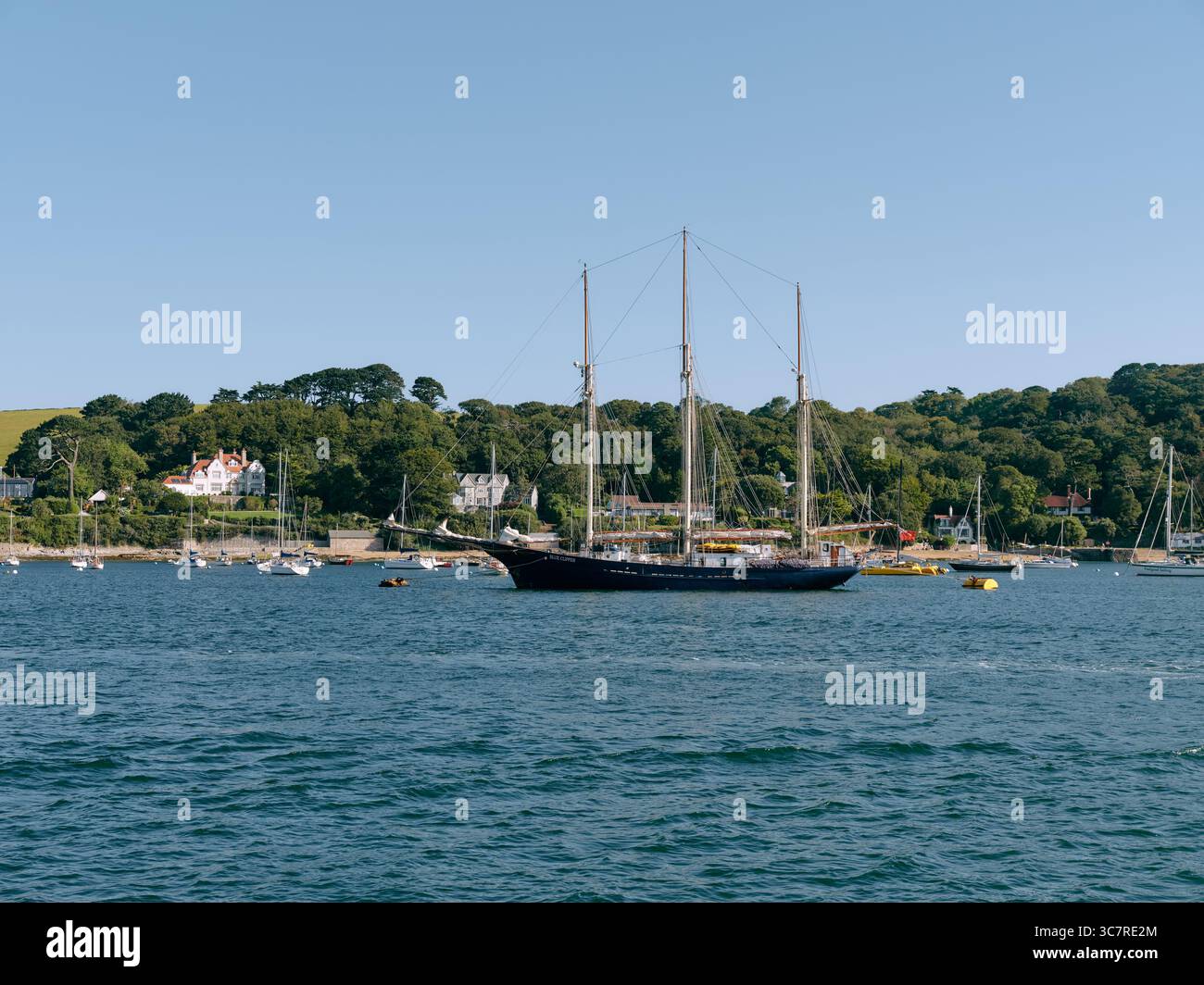 A lone tall ship moored in Falmouth Bay on a summers day Falmouth, Cornwall England UK Stock Photo