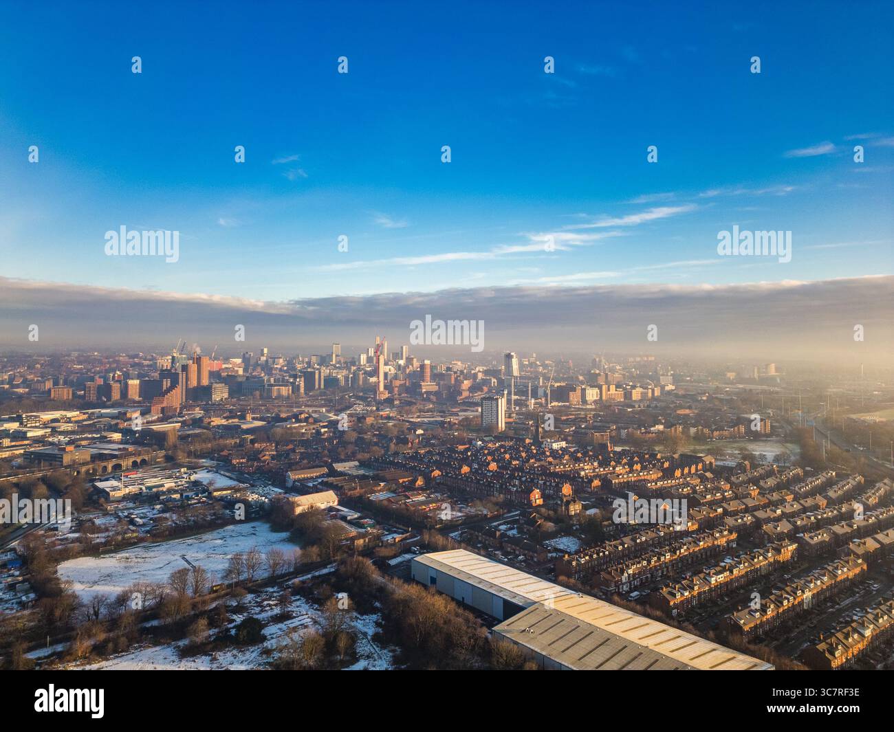 Aerial photo of Leeds city centre skyline showing high‑rise buildings, historic landmarks, and urban development, West Yorkshire, England. Stock Photo