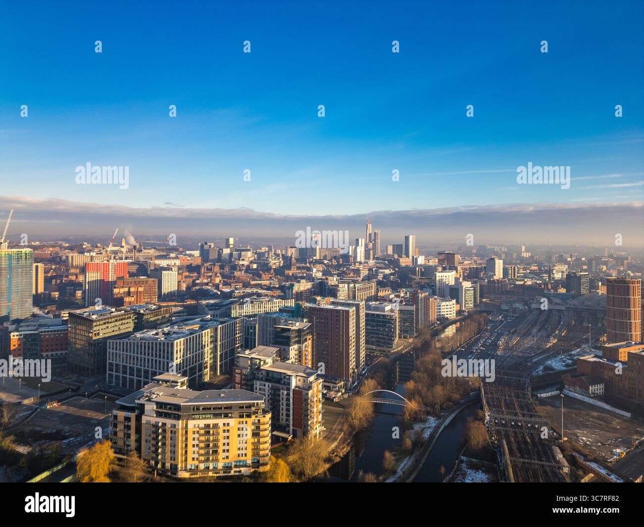 Aerial photo of Leeds city centre skyline showing high‑rise buildings, historic landmarks, and urban development, West Yorkshire, England. Stock Photo