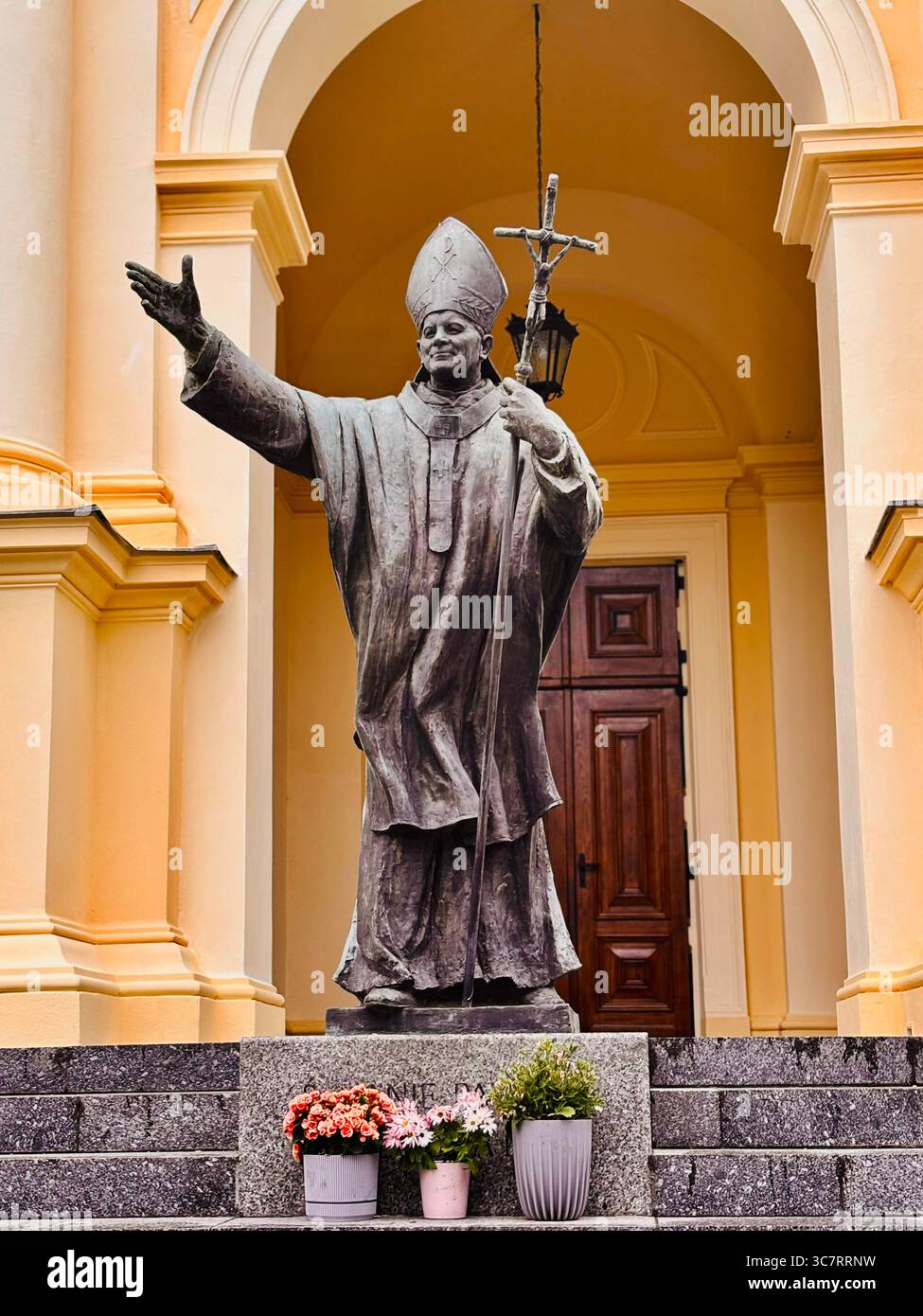 Statue of John Paul II outside the All Saints Church in Warsaw, Poland. - Smartphone Captured Stock Image