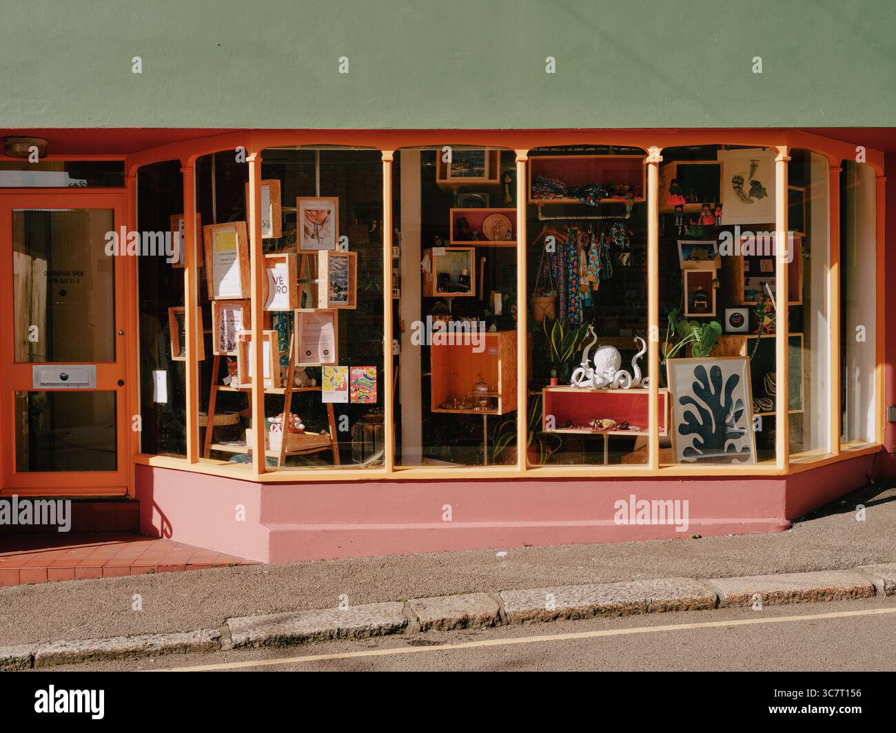 A high street shop window display in Falmouth, Cornwall England UK Stock Photo