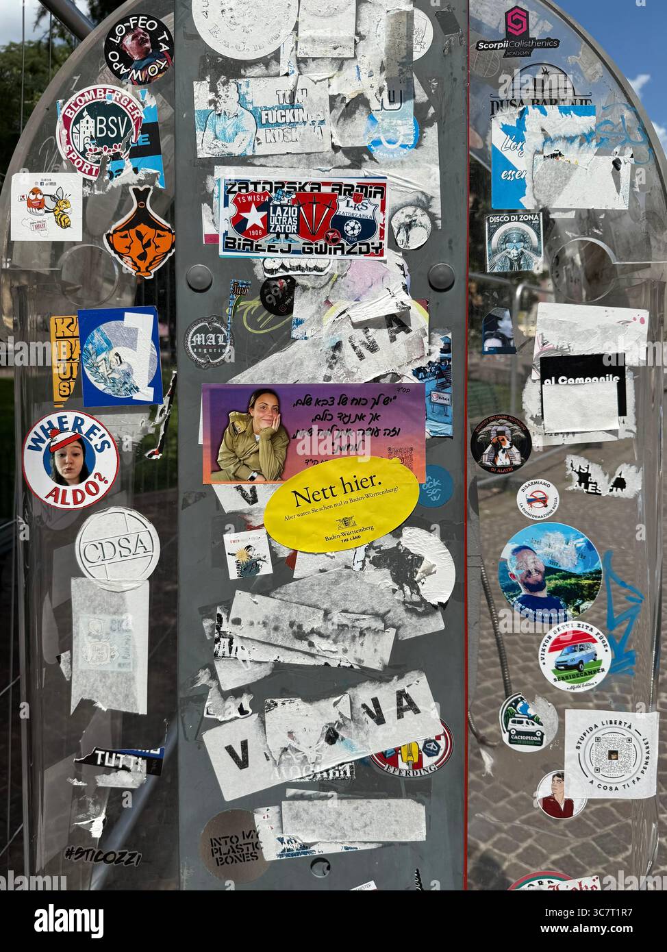 Stickers and graffiti on public phone kiosk in Piazza Bra, Verona Italy - Smartphone Captured Stock Image