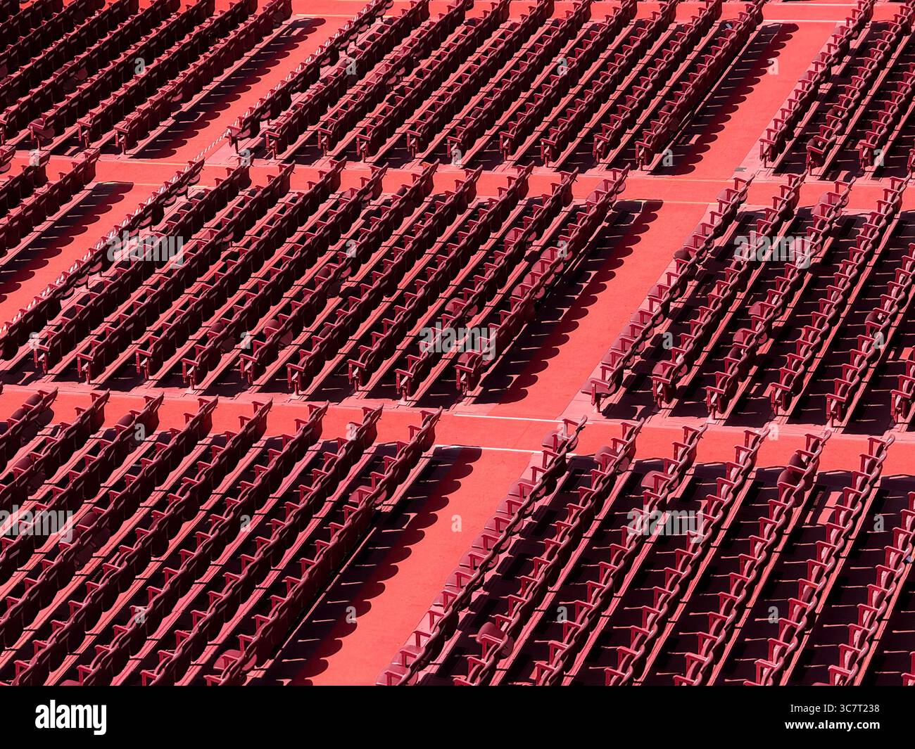 Abstract of empty red seats in the Roman arena (amphitheater) at Verona, Italy - Smartphone Captured Stock Image