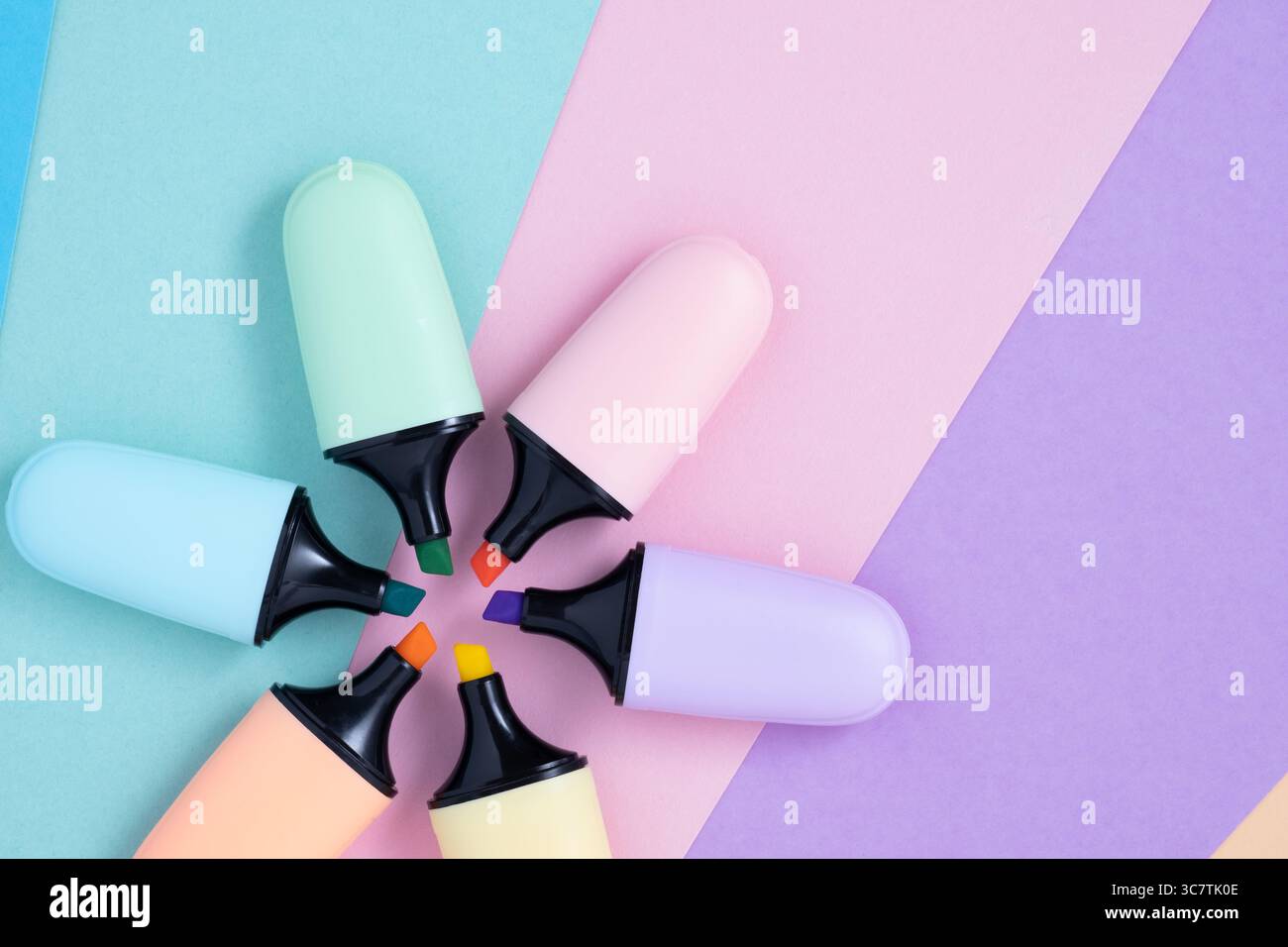 Paste colorl marker pens on multi-colored background. Multi-colored highlighter, close-up Stock Photo
