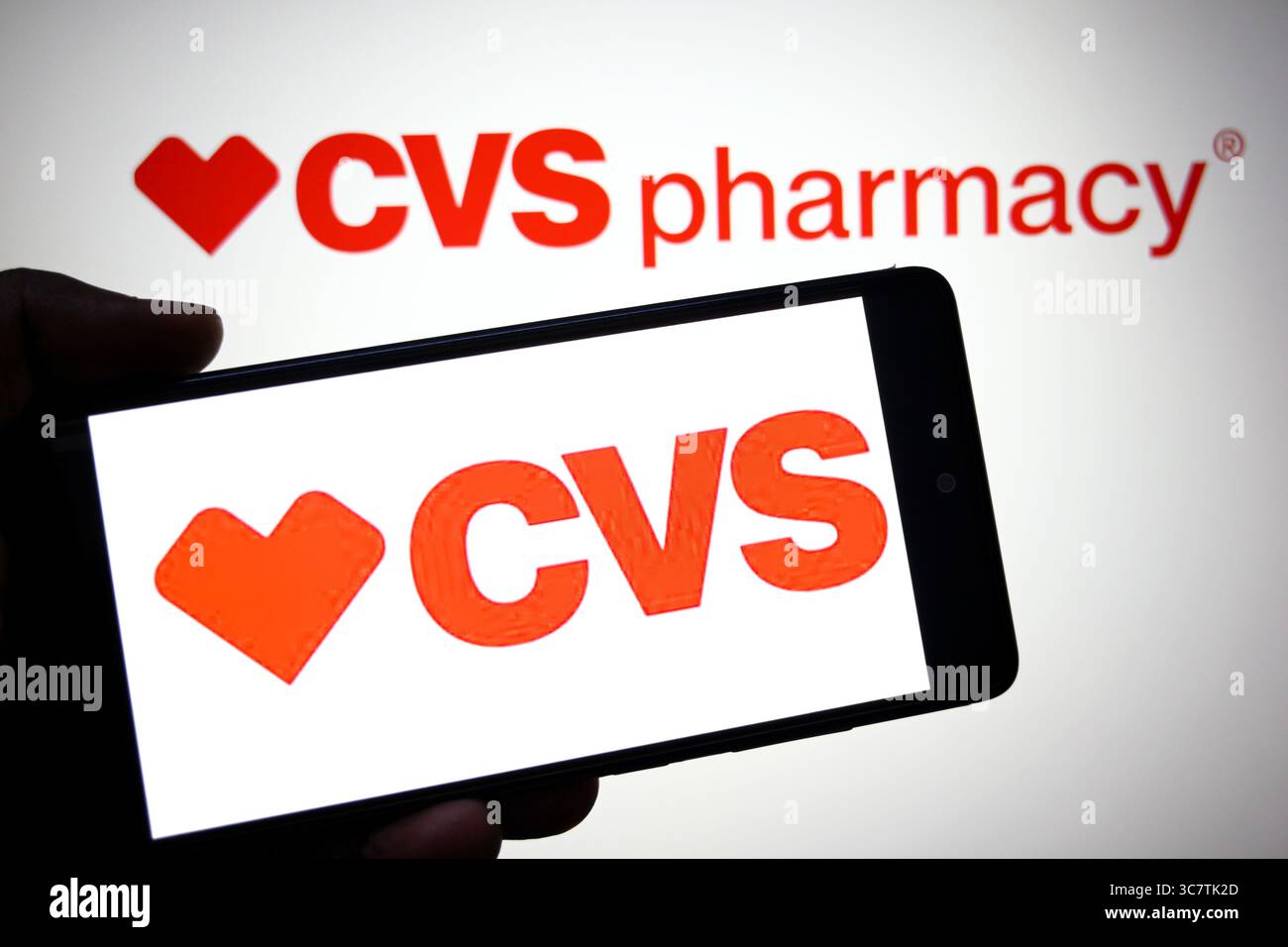 In this photo illustration, a CVS logo is seen displayed on a ...