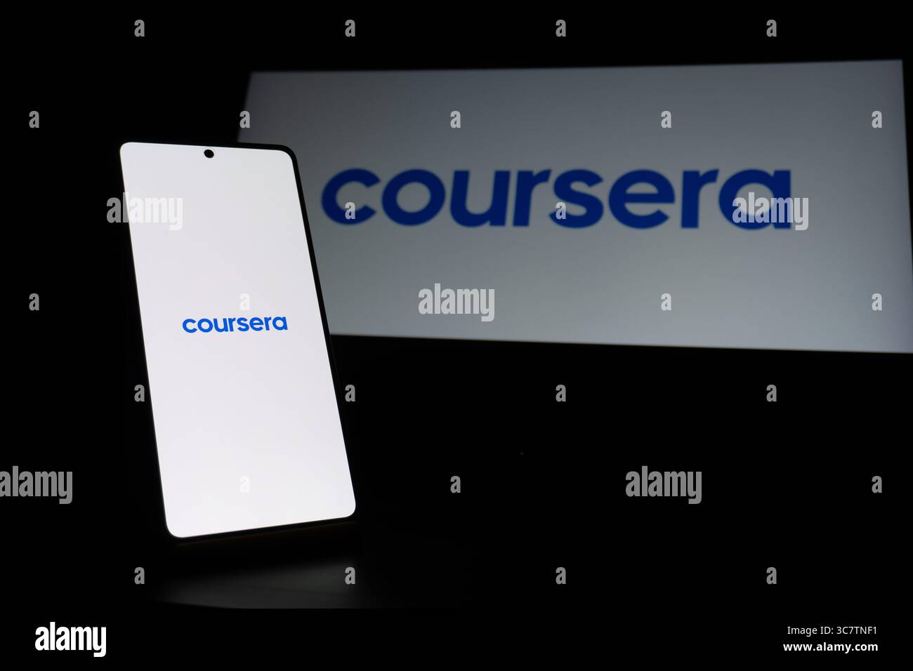 Coursera educational platform logo is described on a screen. Oghuz, Azerbaijan. 11.07.2025. Stock Photo