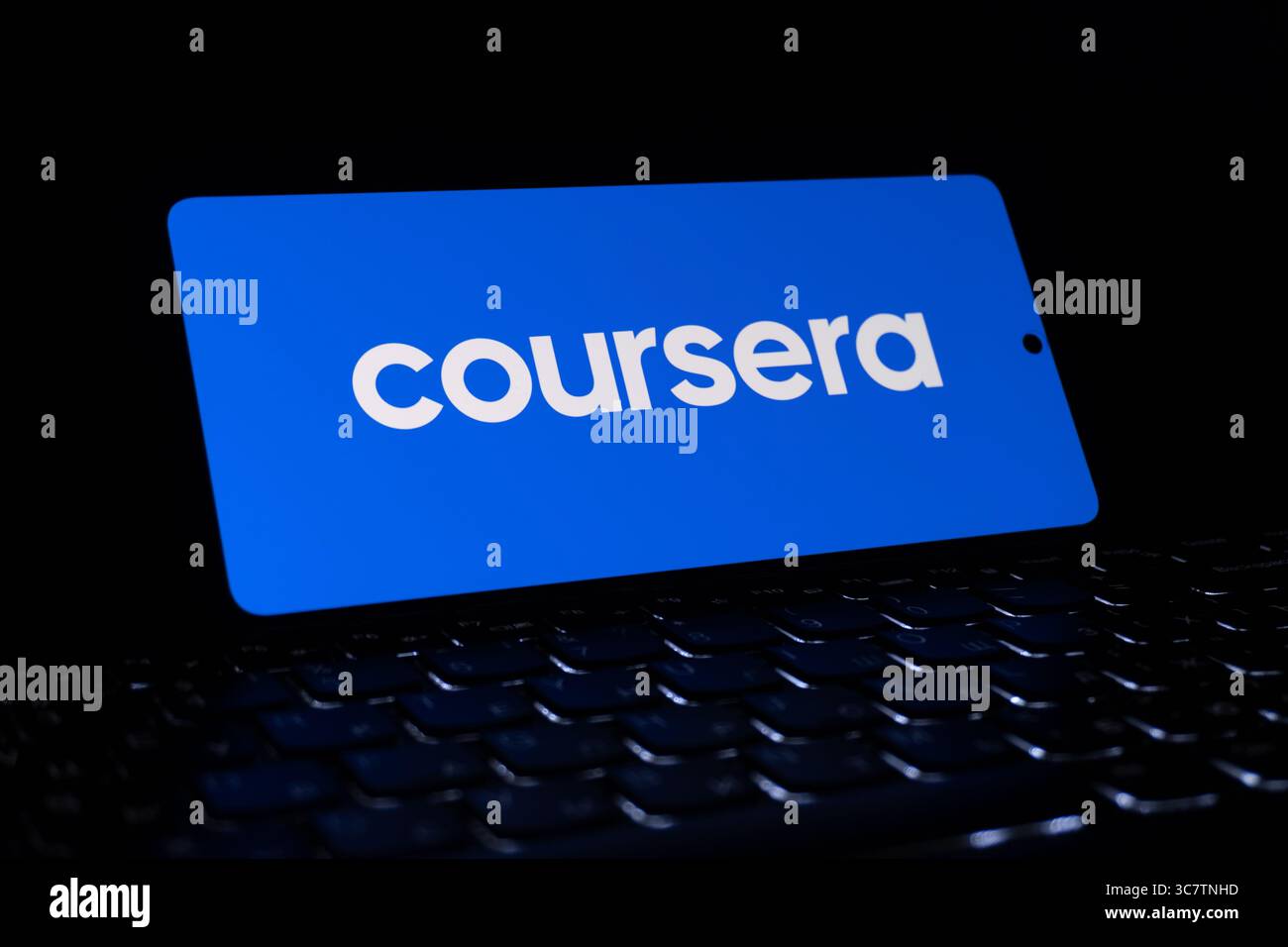 Coursera educational platform logo is described on a screen. Oghuz, Azerbaijan. 11.07.2025. Stock Photo