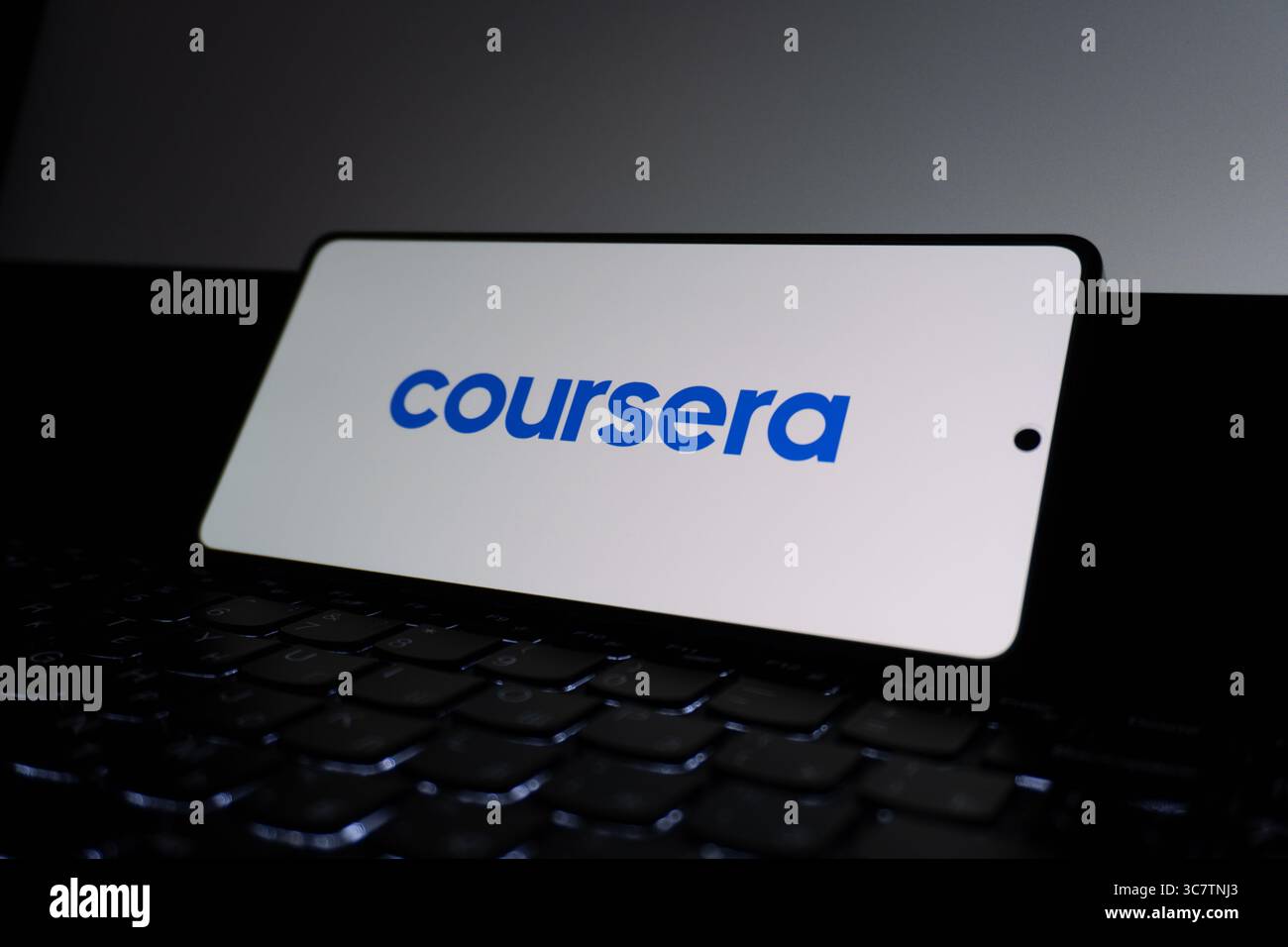 Coursera educational platform logo is described on a screen. Oghuz, Azerbaijan. 11.07.2025. Stock Photo