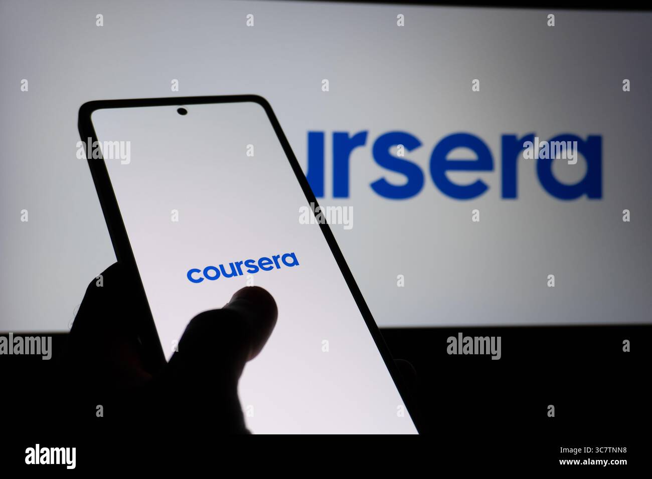 Coursera educational platform logo is described on a screen. Oghuz, Azerbaijan. 11.07.2025. Stock Photo