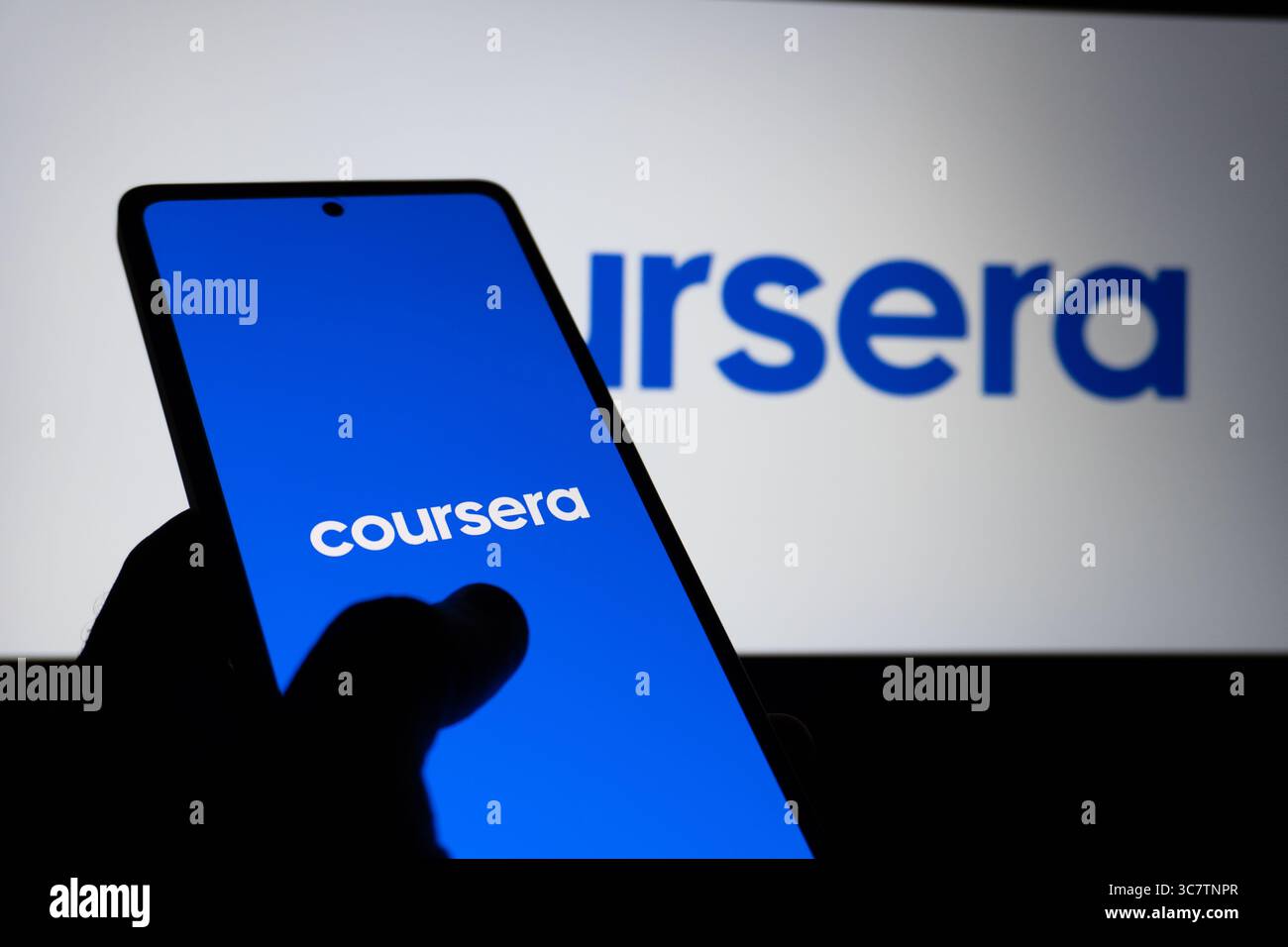 Coursera educational platform logo is described on a screen. Oghuz, Azerbaijan. 11.07.2025. Stock Photo
