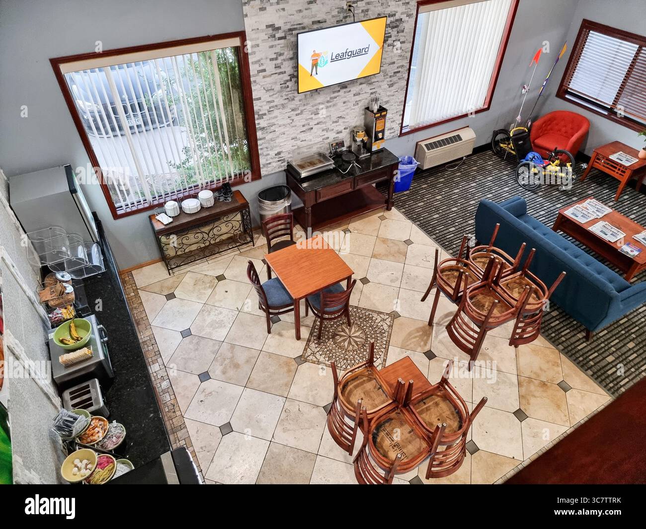 Top view of a hotel lobby with breakfast area; seen from above - Smartphone Captured Stock Image