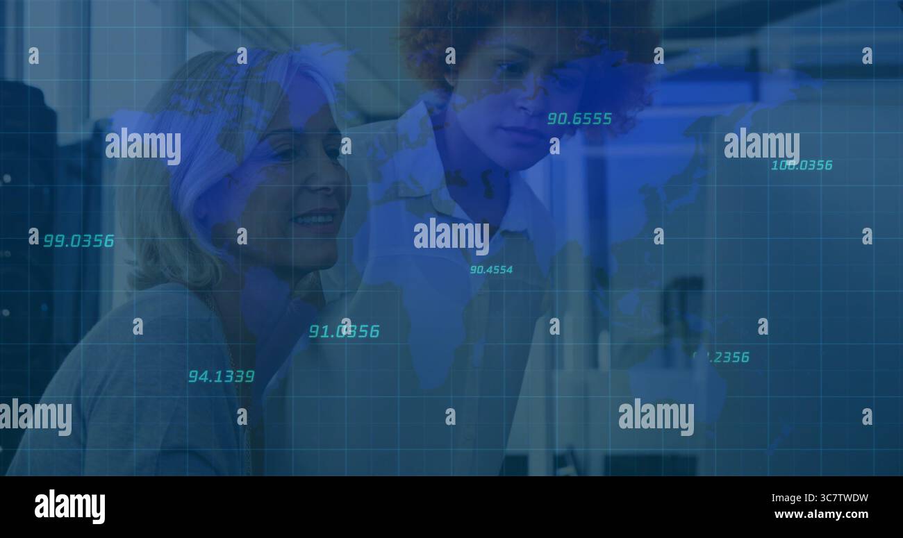 Monitoring data on world map overlay by two professional women working ...