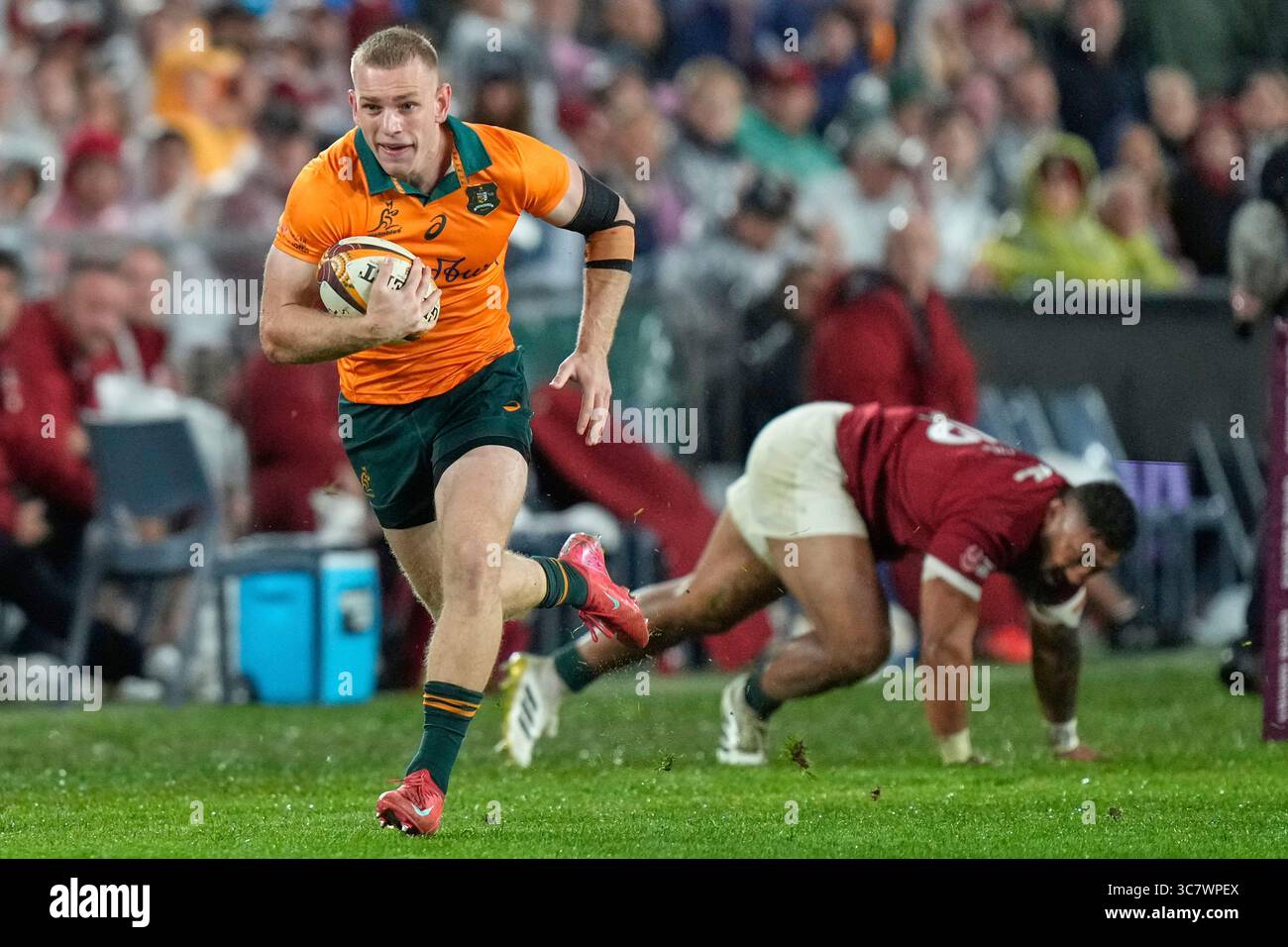 Australia's Max Jorgensen races in to score a try during the third and ...