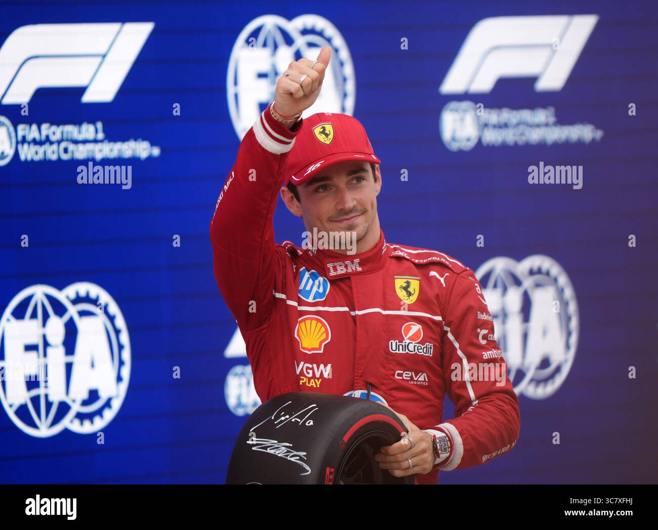 Ferrari's Charles Leclerc celebrates pole after qualifying at the ...