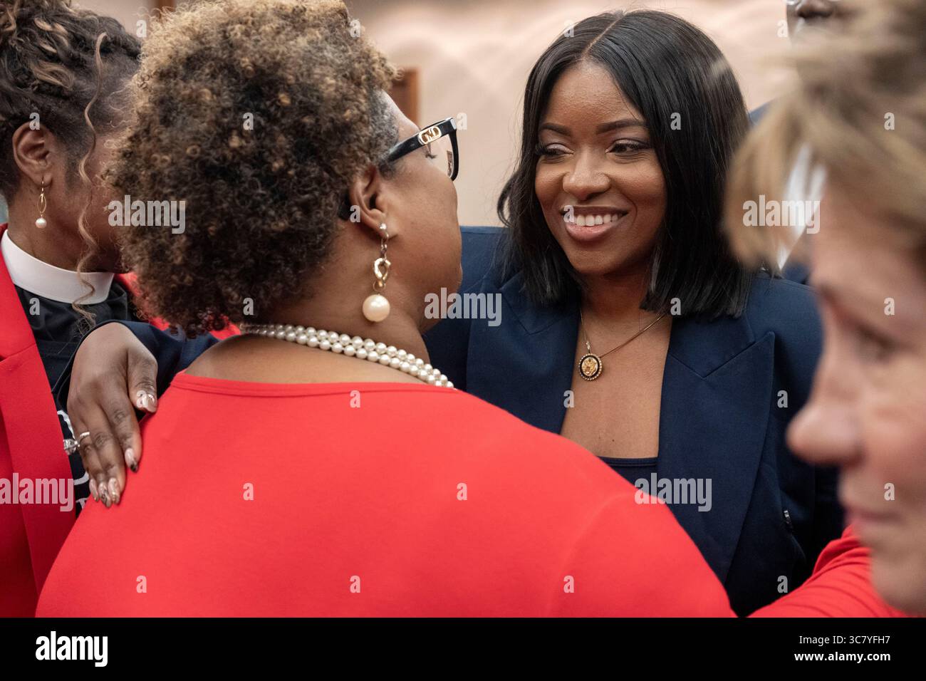 U.S. Representative Jasmine Crockett, D-Dallas, greets supporters during a break in the final public hearing of the House Select Committee on Congressional Redistricting at the Texas Capitol on August 1, 2025. Stock Photo