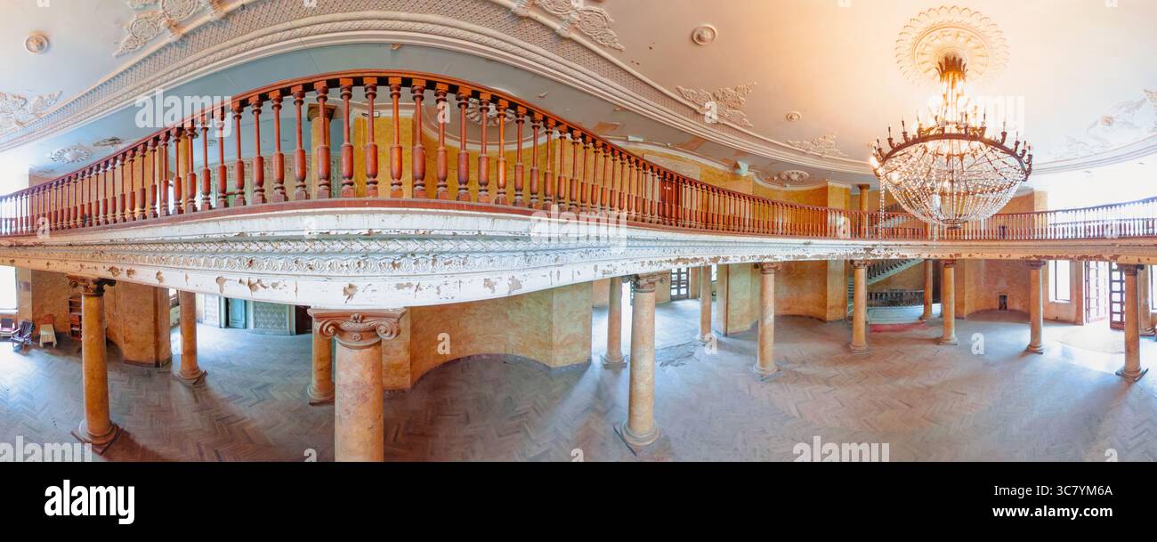 wide-panorama-view-of-decaying-ballroom-with-wooden-balustrade-and