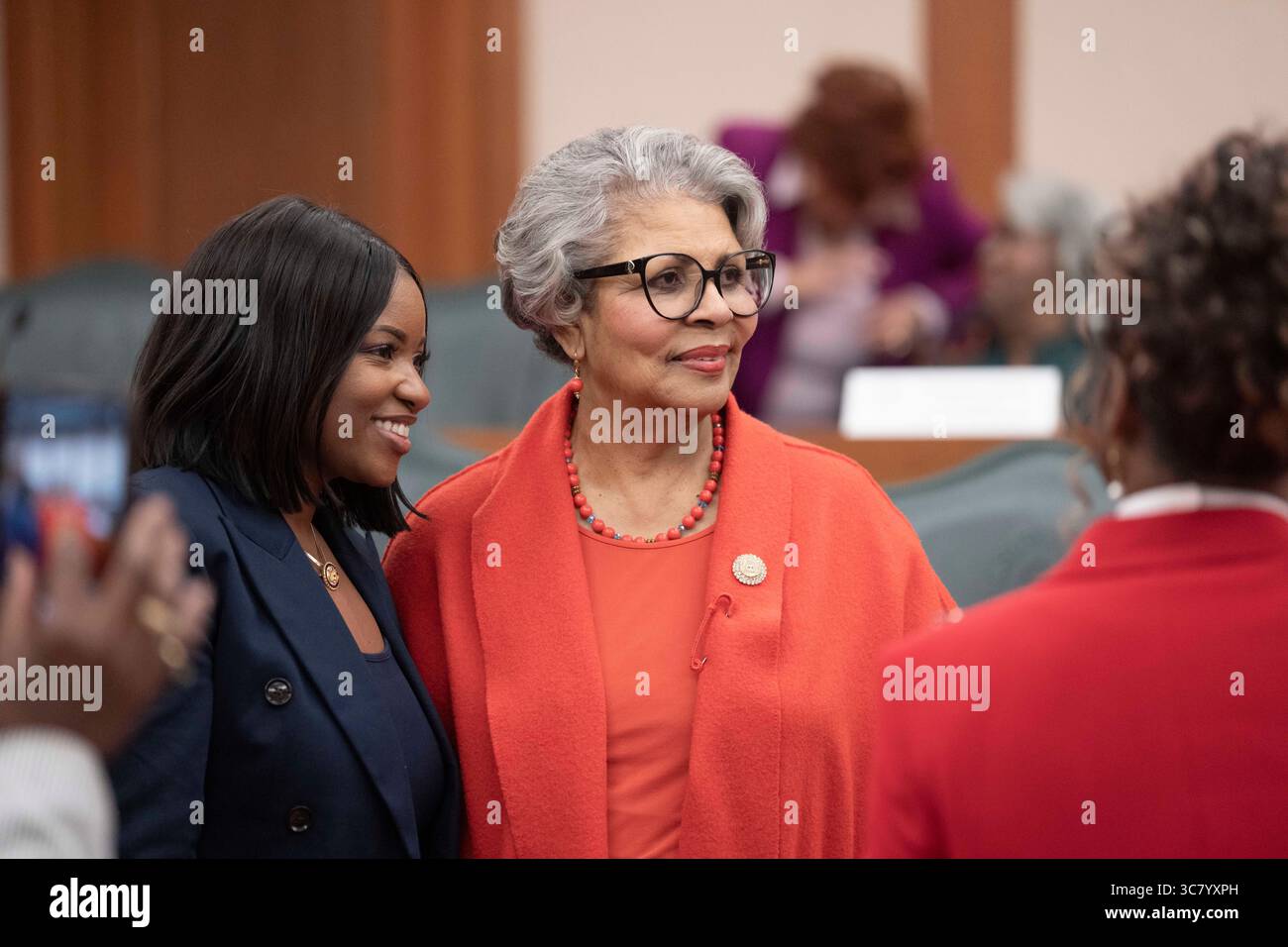 U.S. Representative Jasmine Crockett, D-Dallas, l, greets Rep. Senfronia Thompson, D-Houston, after she answered questions at the witness table during the final public hearing of the House Select Committee on Congressional Redistricting at the Texas Capitol on August 1, 2025. Stock Photo