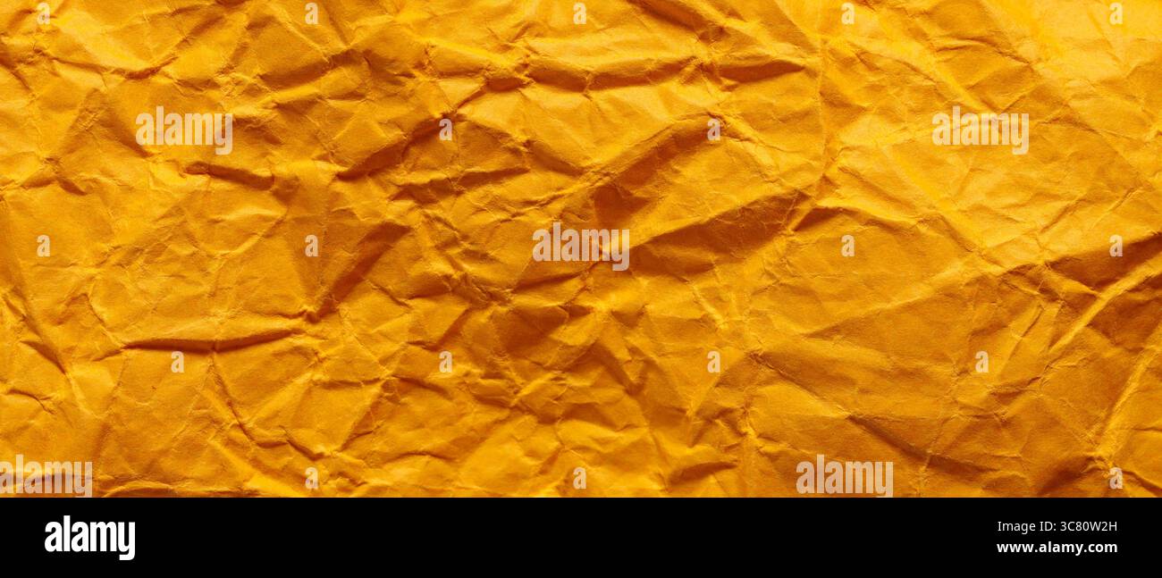 Crumpled Golden Yellow Paper Texture Background Abstract Pattern Stock Photo