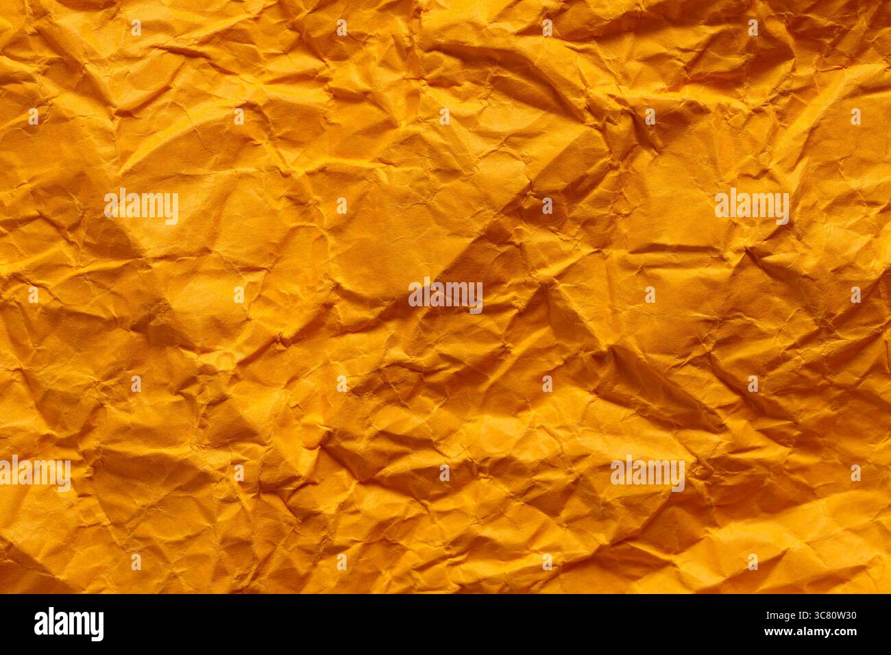Crumpled Golden Yellow Paper Texture Background Abstract Pattern Stock Photo