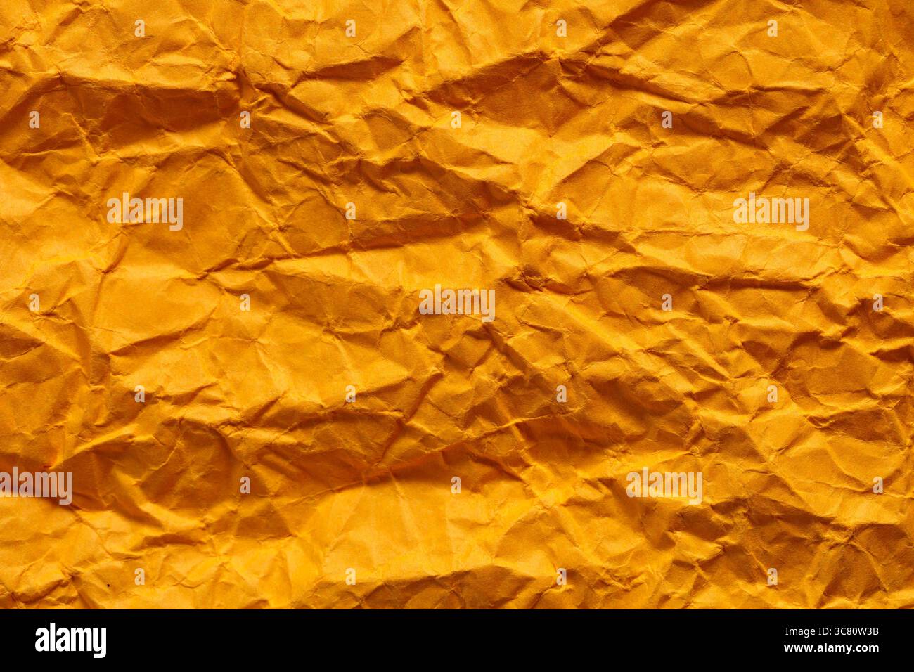 Crumpled Golden Yellow Paper Texture Background Abstract Pattern Stock Photo