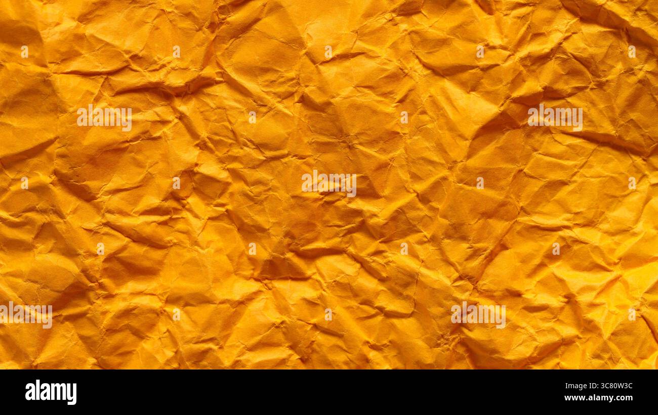 Crumpled Golden Yellow Paper Texture Background Abstract Pattern Stock Photo