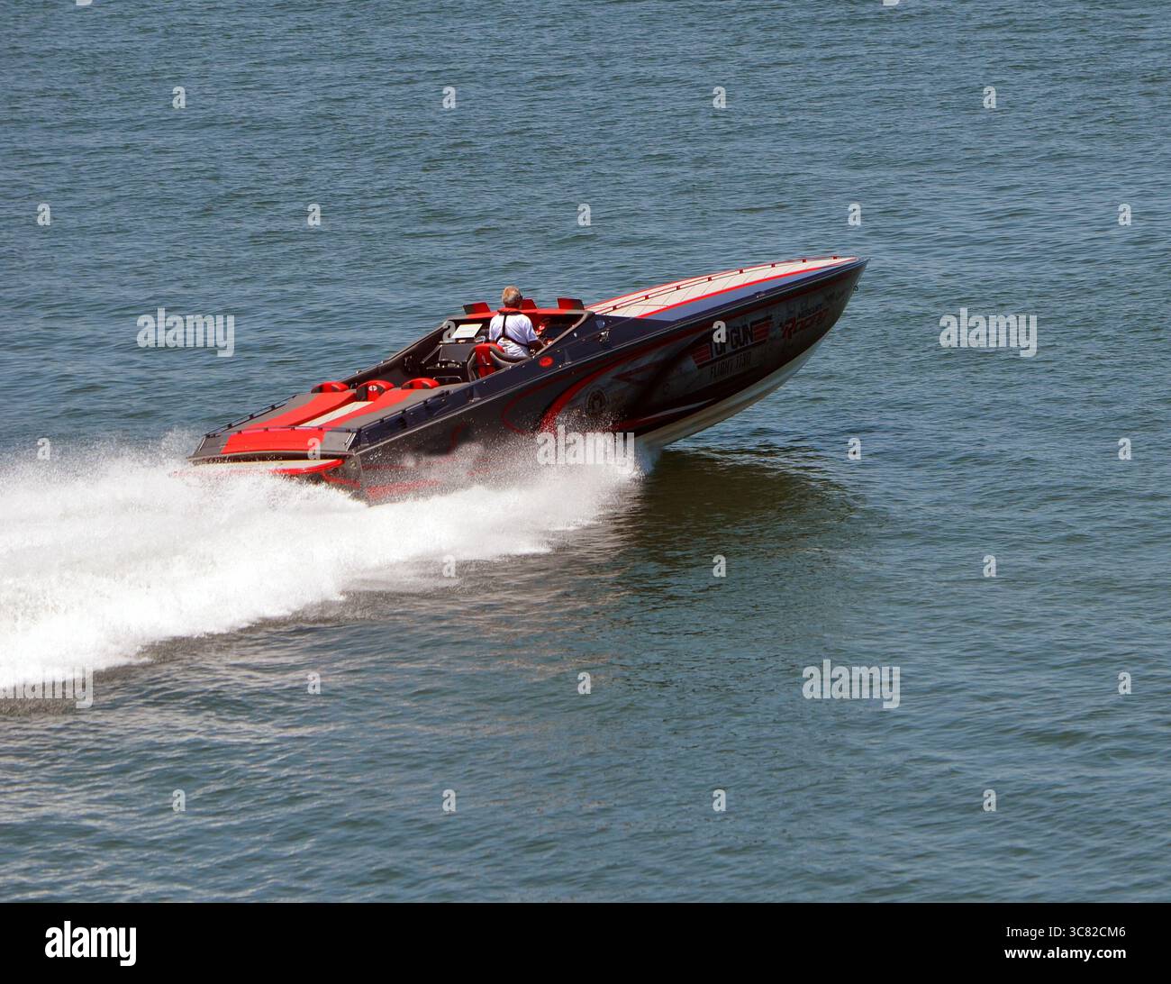 Power speed boat racing across the Florida Intra-Coastal Waterway near ...