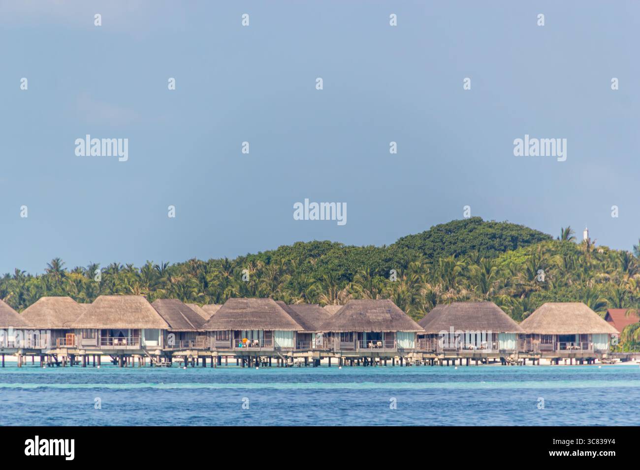 Image showcasing Overwater bungalows provide luxurious island retreat Stock Photo - Alamy