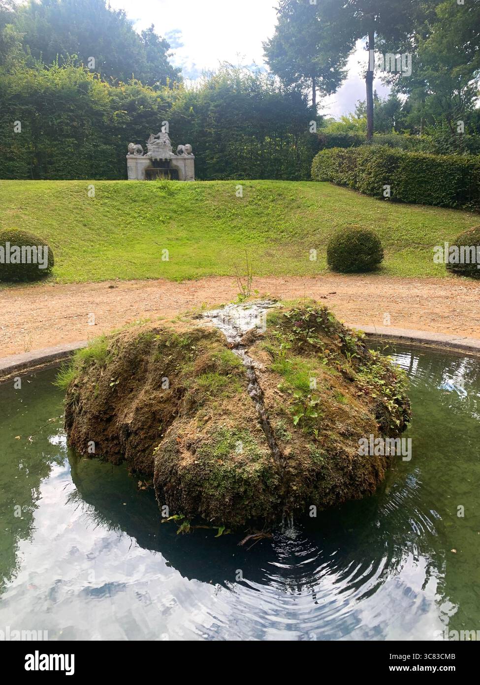 Chateau Bizi France French monument historic place gardens museum old ancient fountain water lake piano harp playing play people performance - Smartphone Captured Stock Image