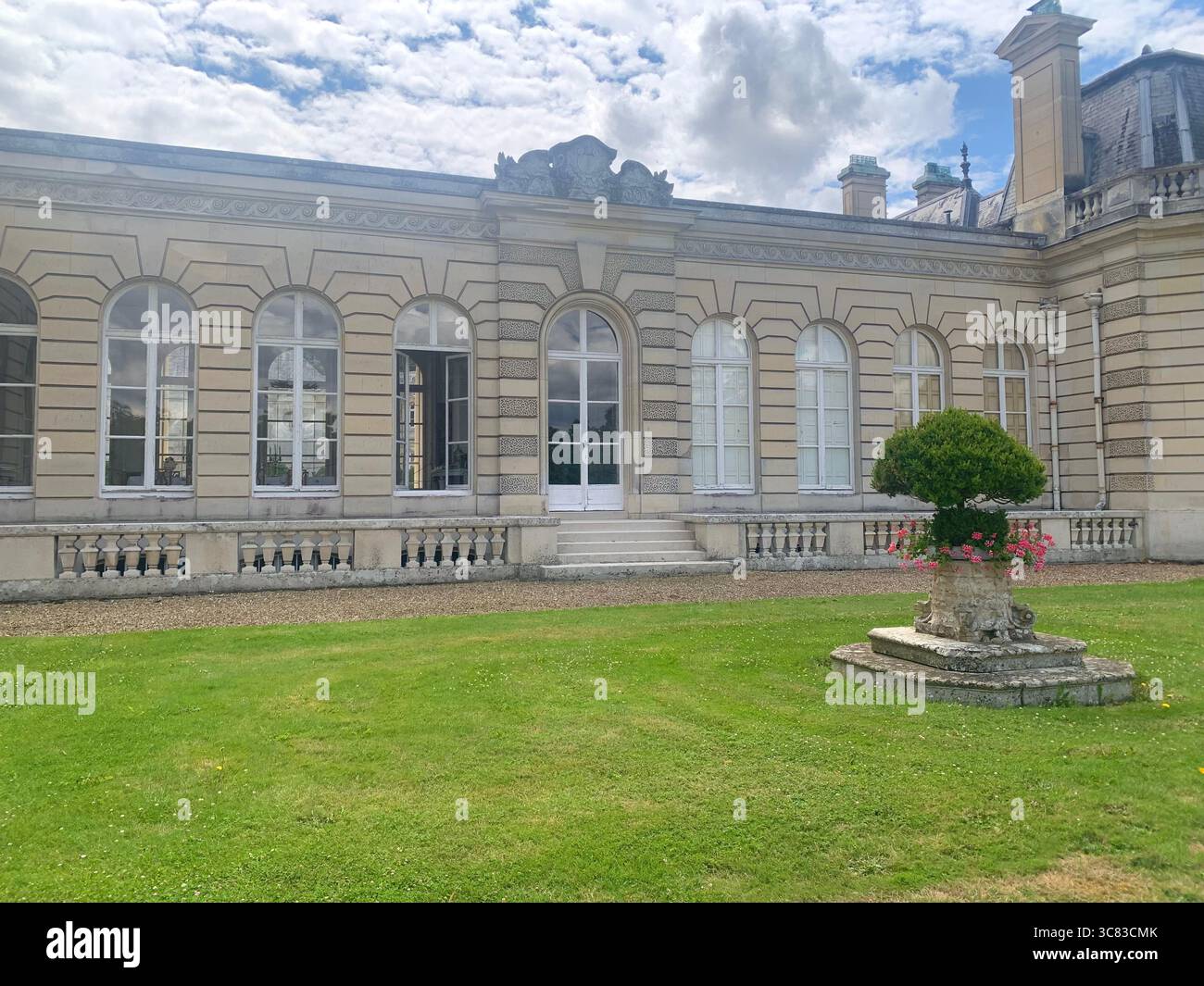 Chateau Bizi France French monument historic place gardens museum old ancient fountain water lake piano harp playing play people performance - Smartphone Captured Stock Image