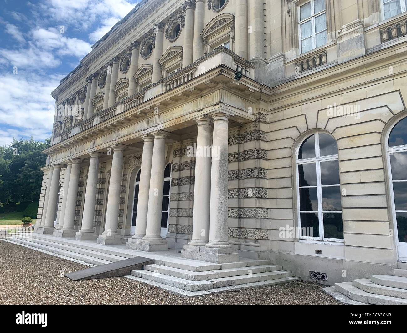 Chateau Bizi France French monument historic place gardens museum old ancient fountain water lake piano harp playing play people performance - Smartphone Captured Stock Image