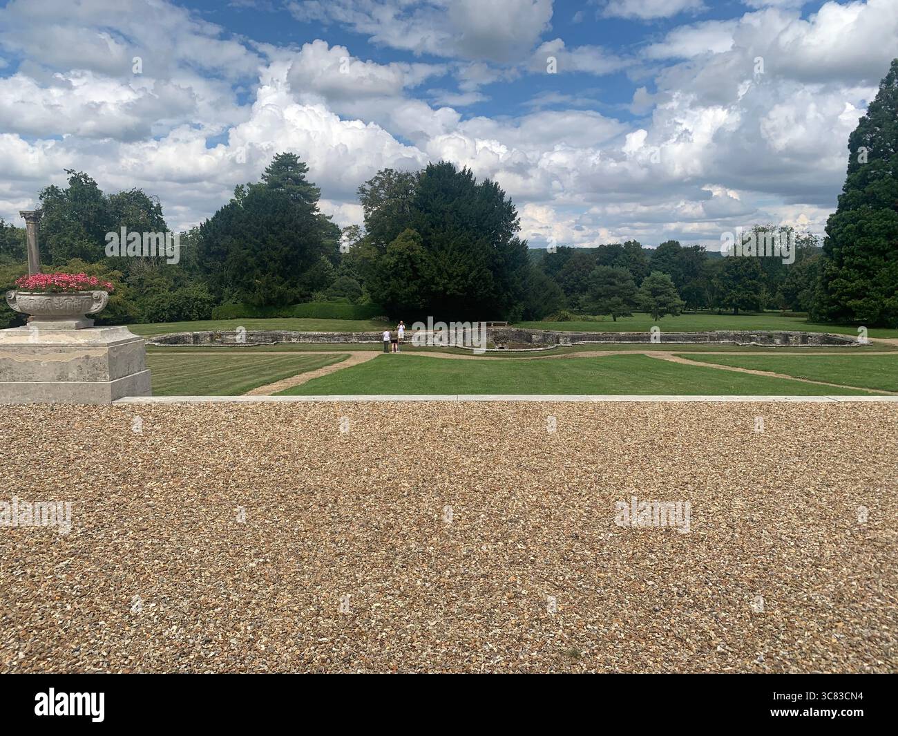 Chateau Bizi France French monument historic place gardens museum old ancient fountain water lake piano harp playing play people performance - Smartphone Captured Stock Image