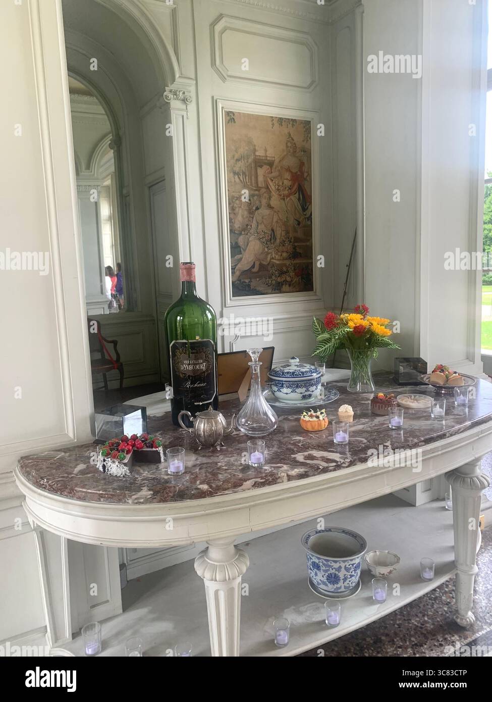 Chateau Bizi France French monument historic place gardens museum old ancient fountain water lake piano harp playing play people performance - Smartphone Captured Stock Image