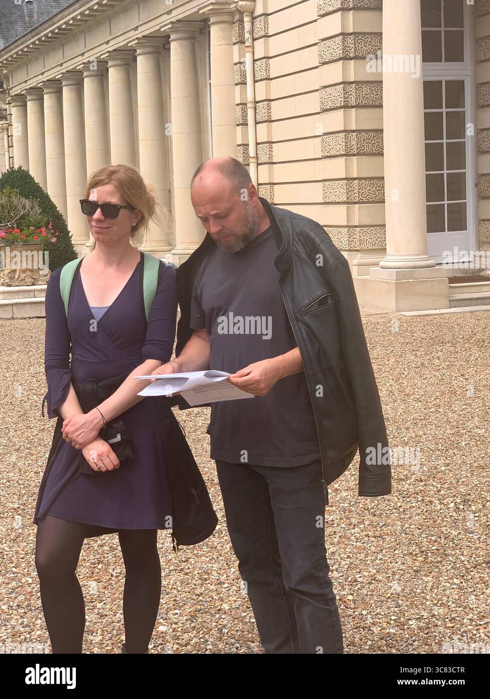 Chateau Bizi France French monument historic place gardens museum old ancient fountain water lake piano harp playing play people performance - Smartphone Captured Stock Image