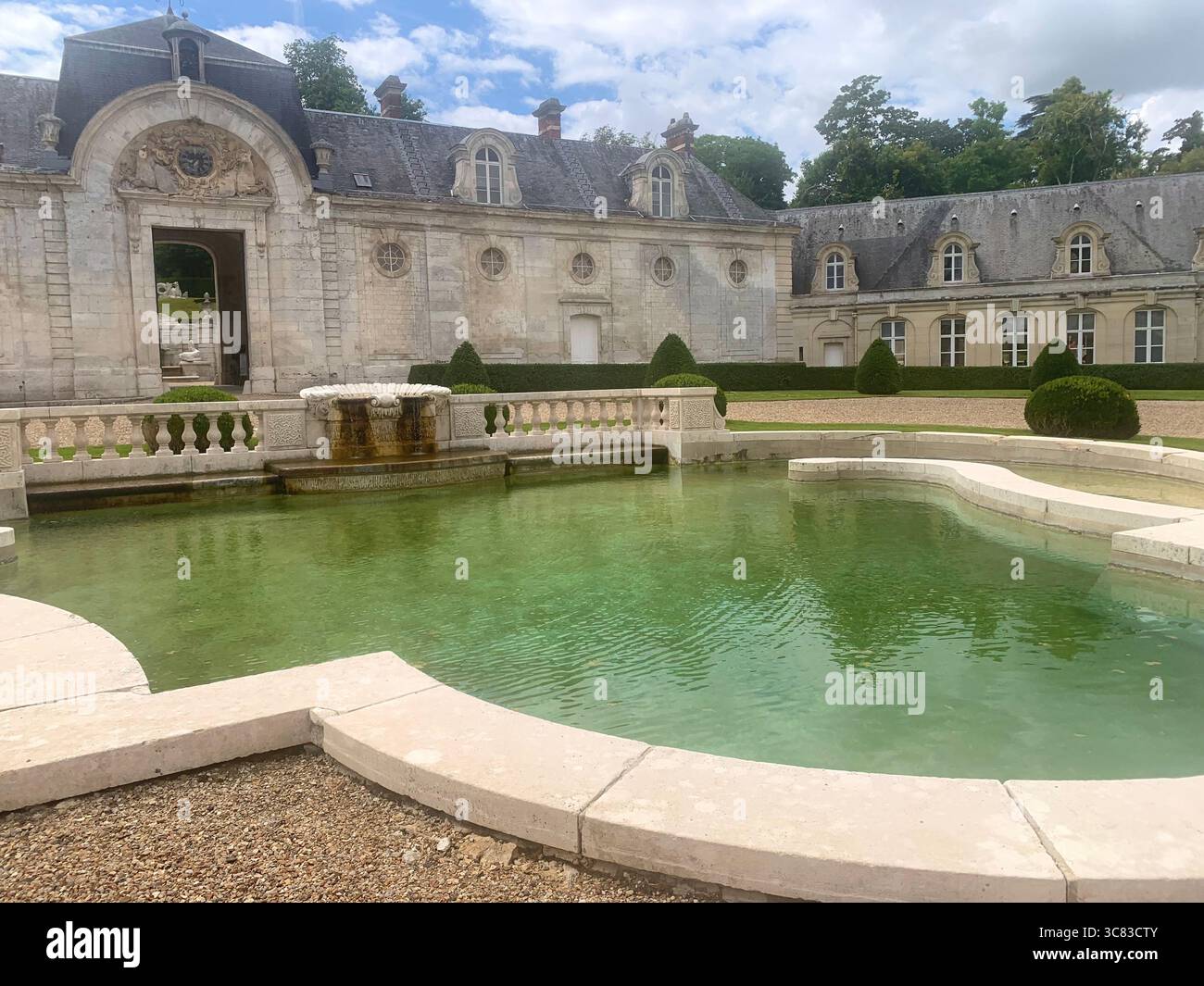 Chateau Bizi France French monument historic place gardens museum old ancient fountain water lake piano harp playing play people performance - Smartphone Captured Stock Image
