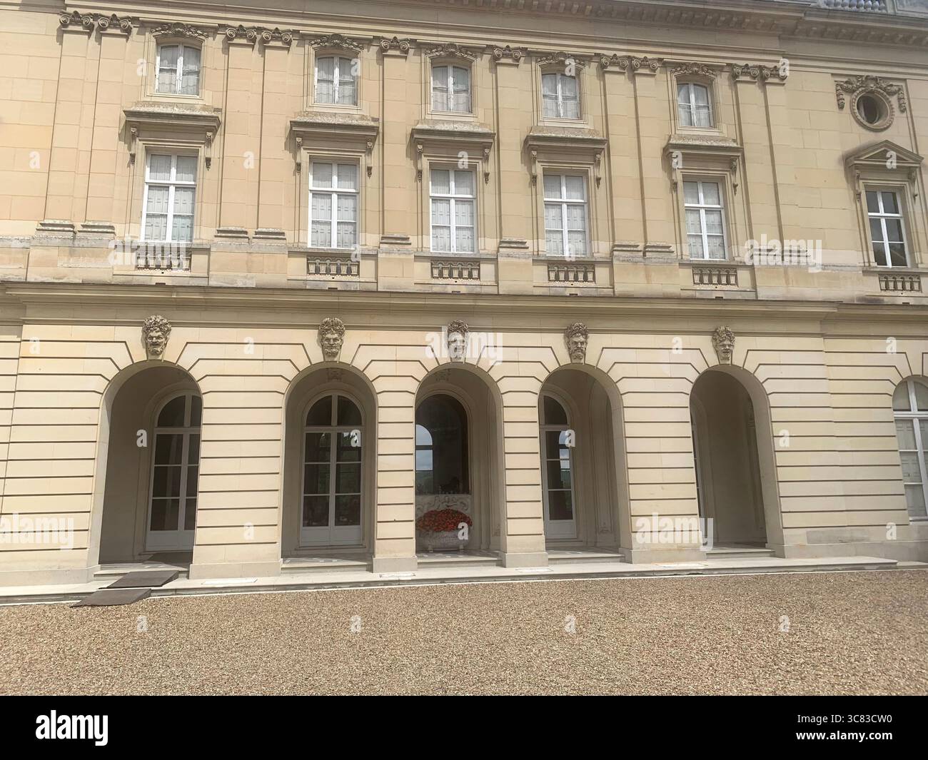 Chateau Bizi France French monument historic place gardens museum old ancient fountain water lake piano harp playing play people performance - Smartphone Captured Stock Image